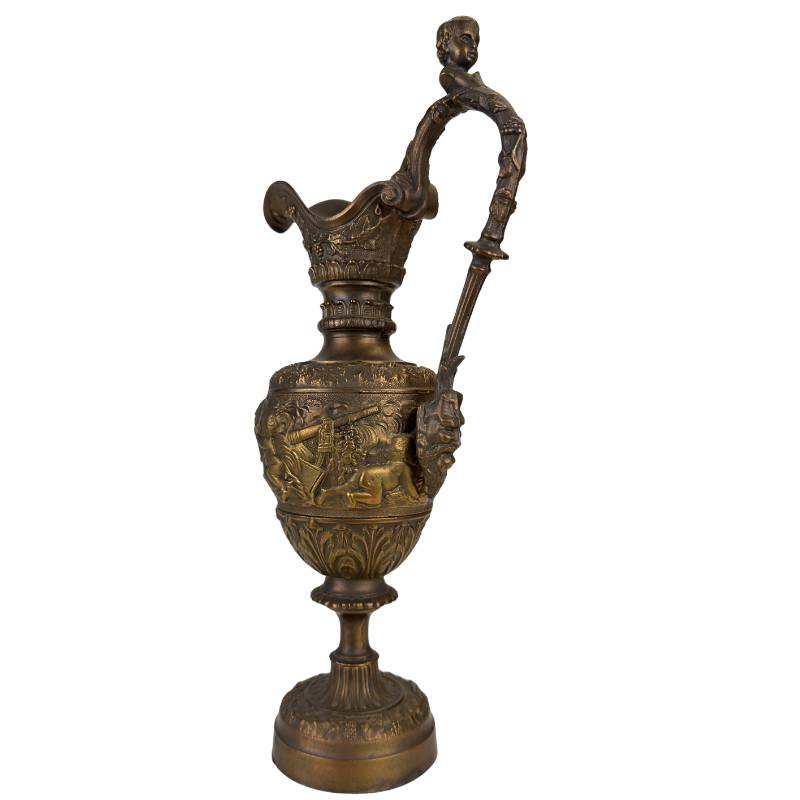 Decorative bronze jug for classic interior with ornaments