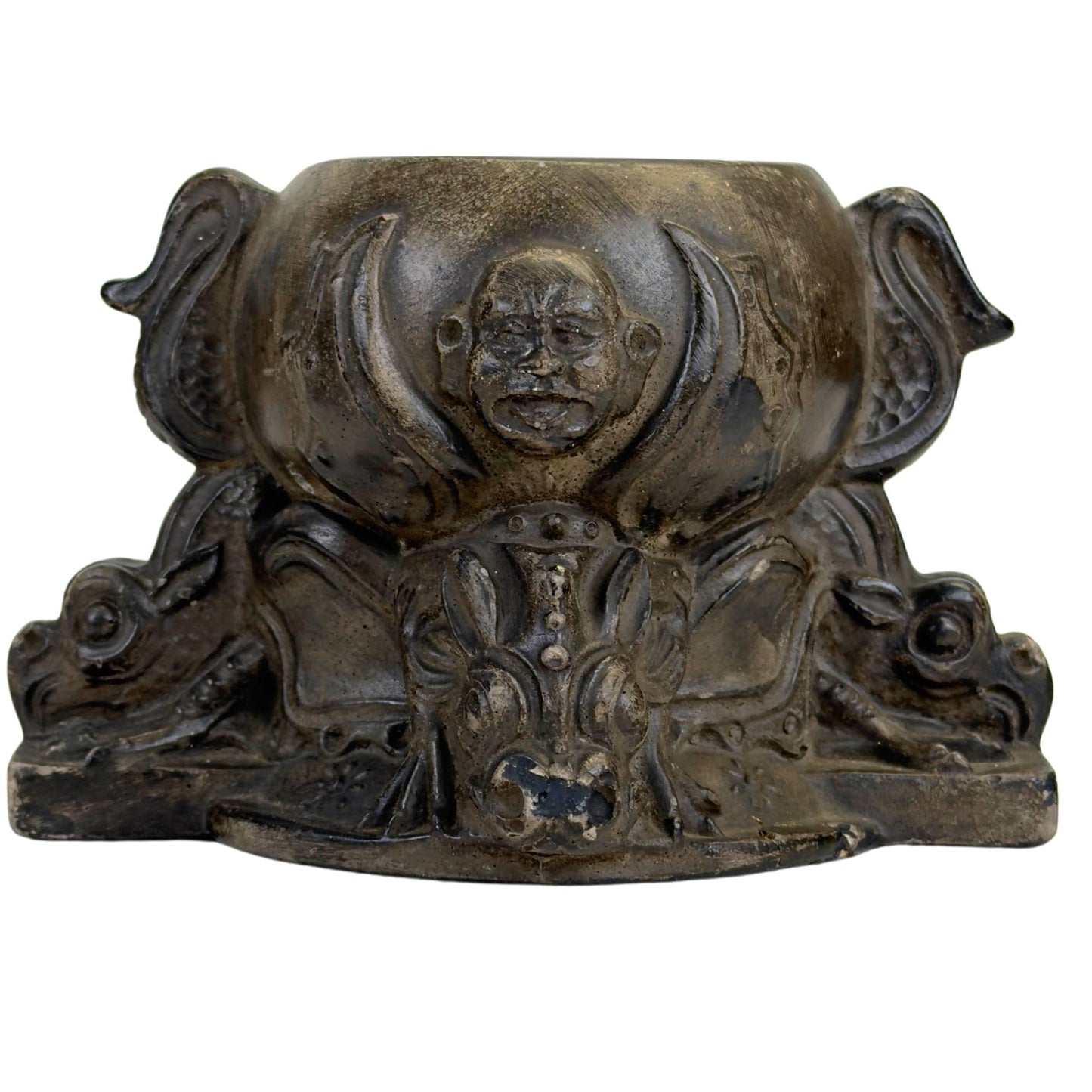 Decorative pot with dragons and expressive facial motifs