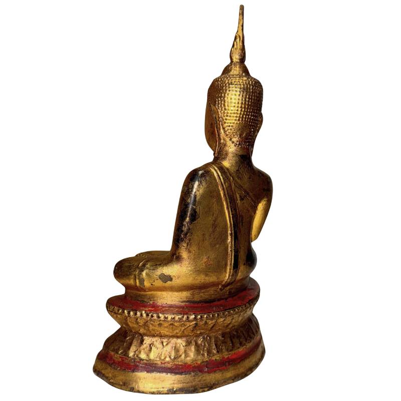Detailed face of serene Lanna Buddha gilded