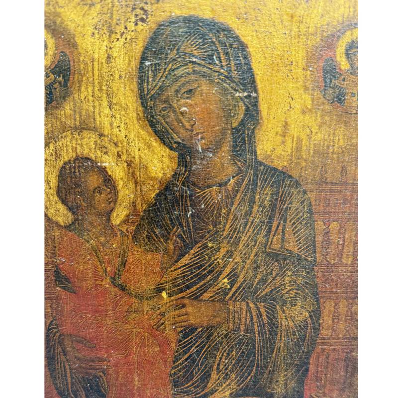 Beautiful detail shot of the faces of Mary and the Christ Child with visible antique craquelé and gold ground.