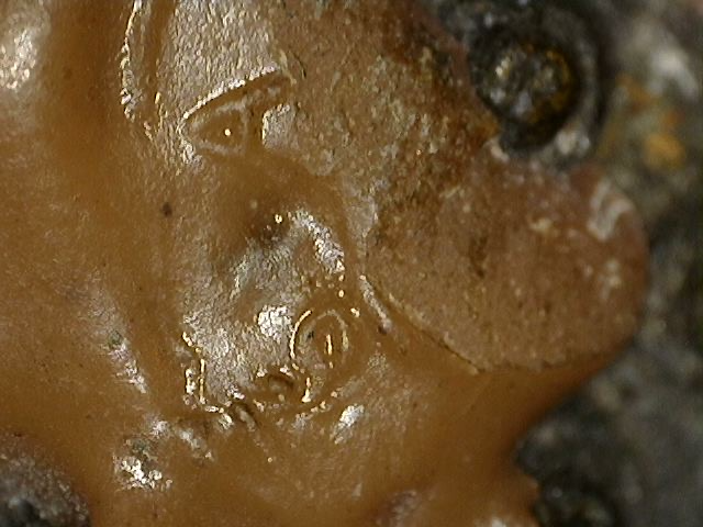 Detail of a wax seal-like pattern on a Chinese bronze Buddha statue