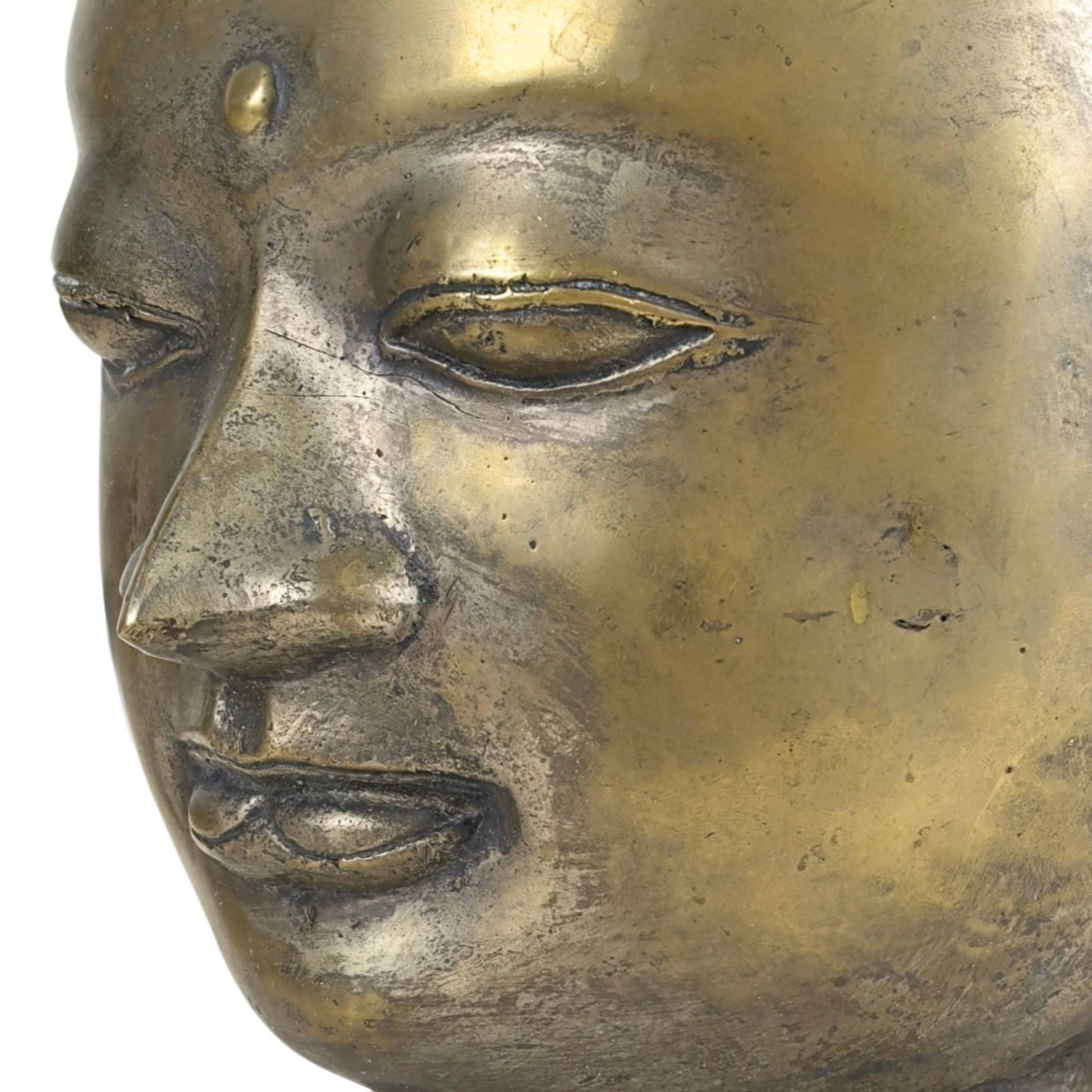 Detail of the eye of a bronze Buddha sculpture