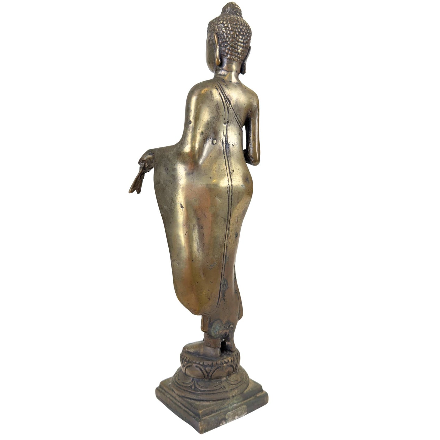 Close-up of the serene facial expression of an antique bronze Buddha.