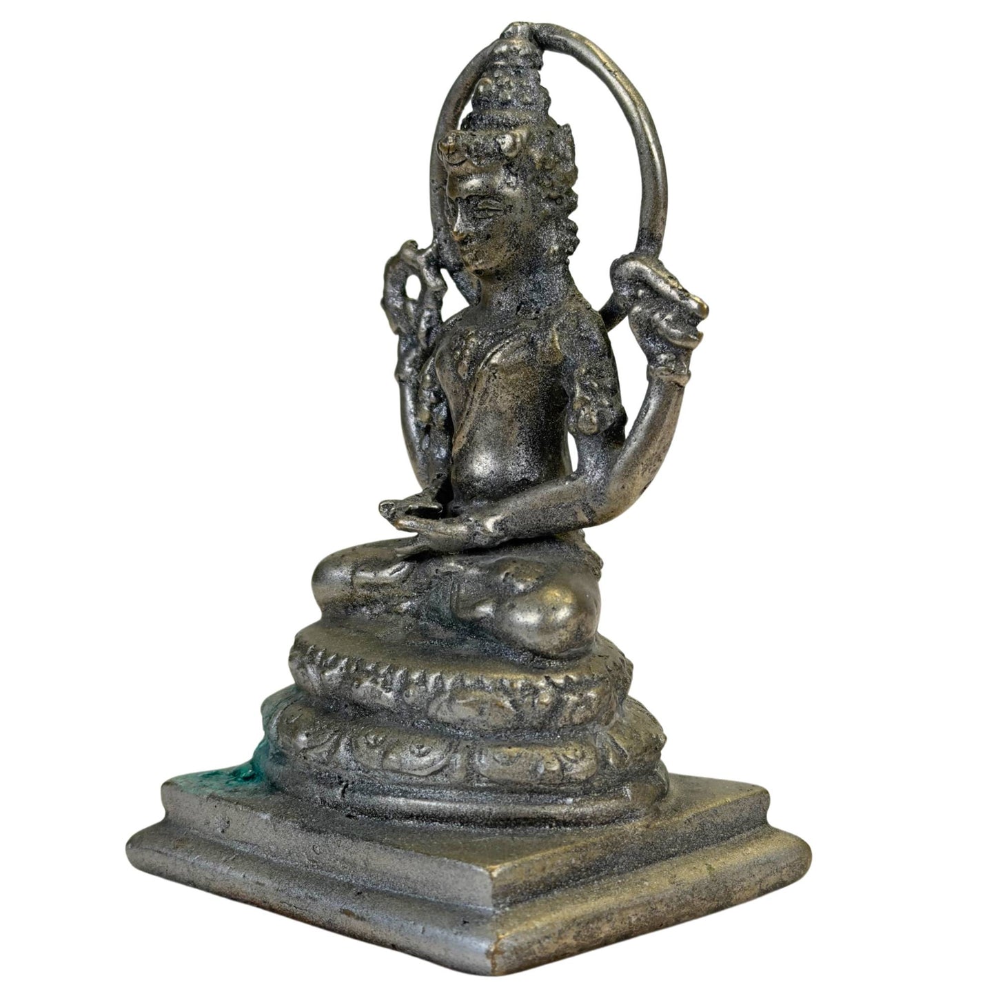 Detail of Vishnu halo and headdress on a compact Indonesian bronze statue with a weathered surface