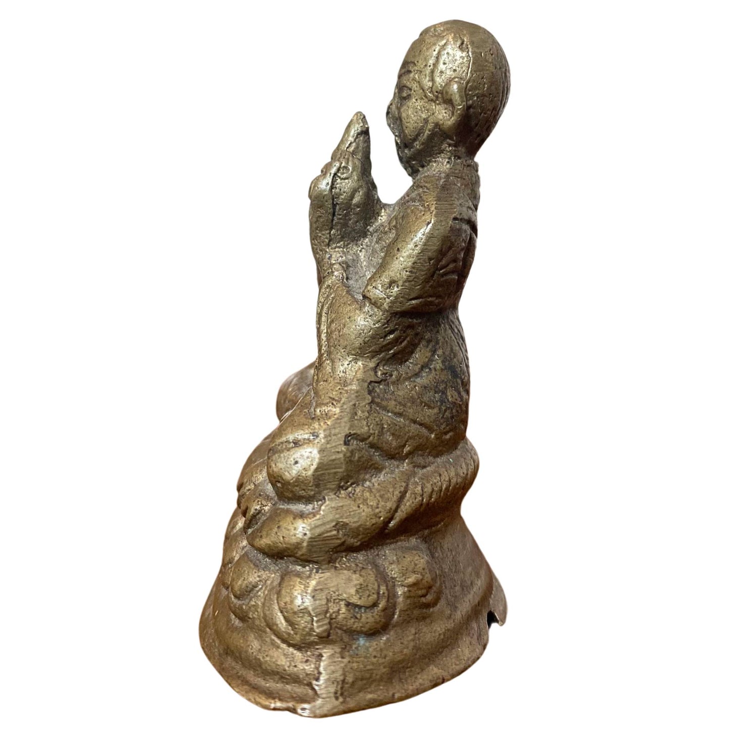 Close-up of the bronze figure with clear traces of original fire gilding in the deeper folds.