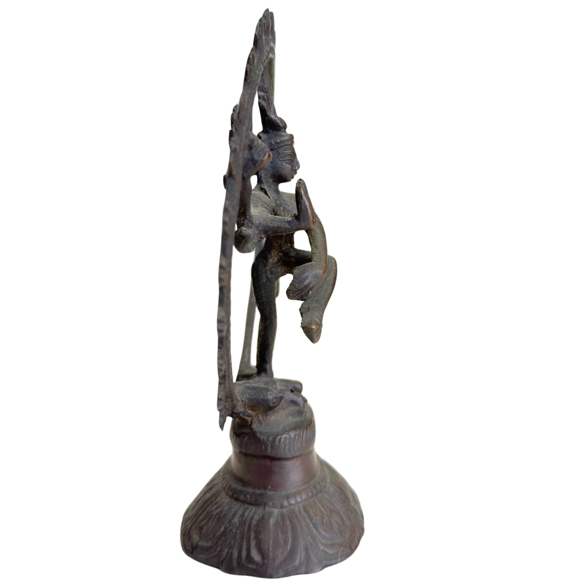 Dark bronze Shiva Nataraja figurine with open flame ring and spiritual aura