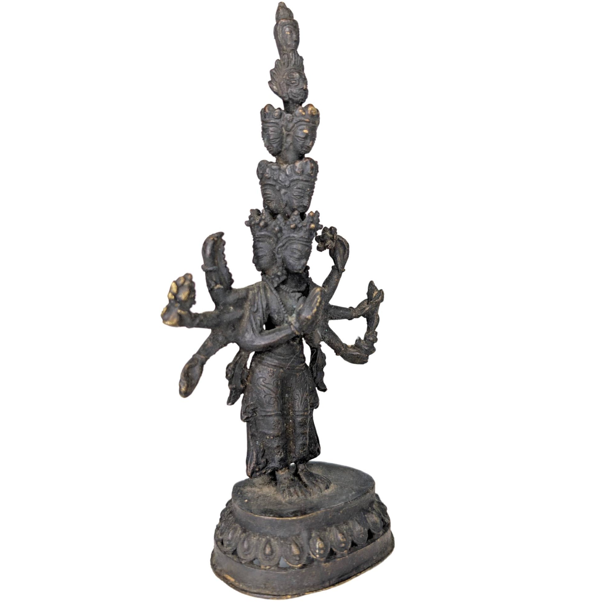 Complex multi-headed and multi-armed iconography of the Bodhisattva of Compassion.