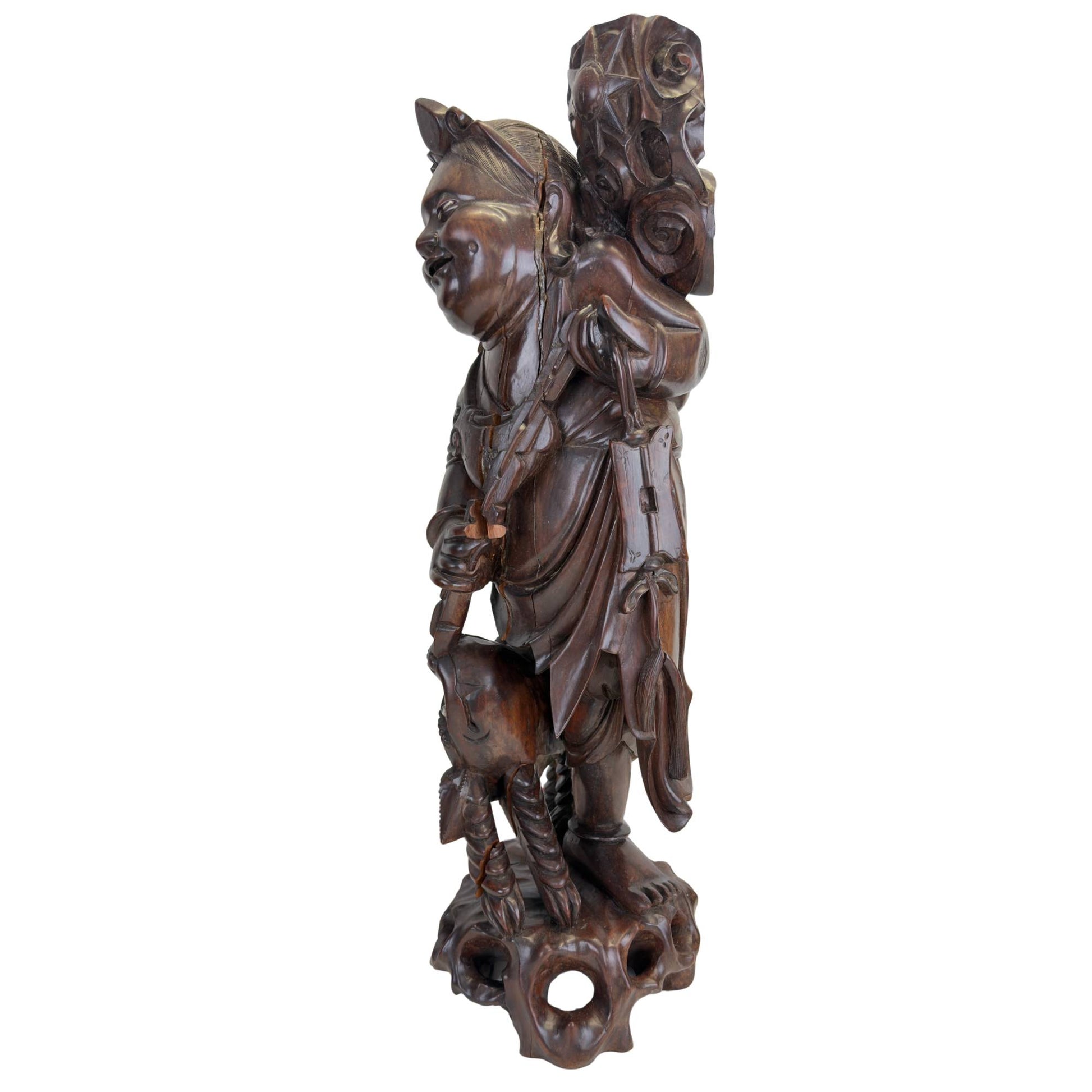 Ebisu statue with characteristic natural age cracks in the wood
