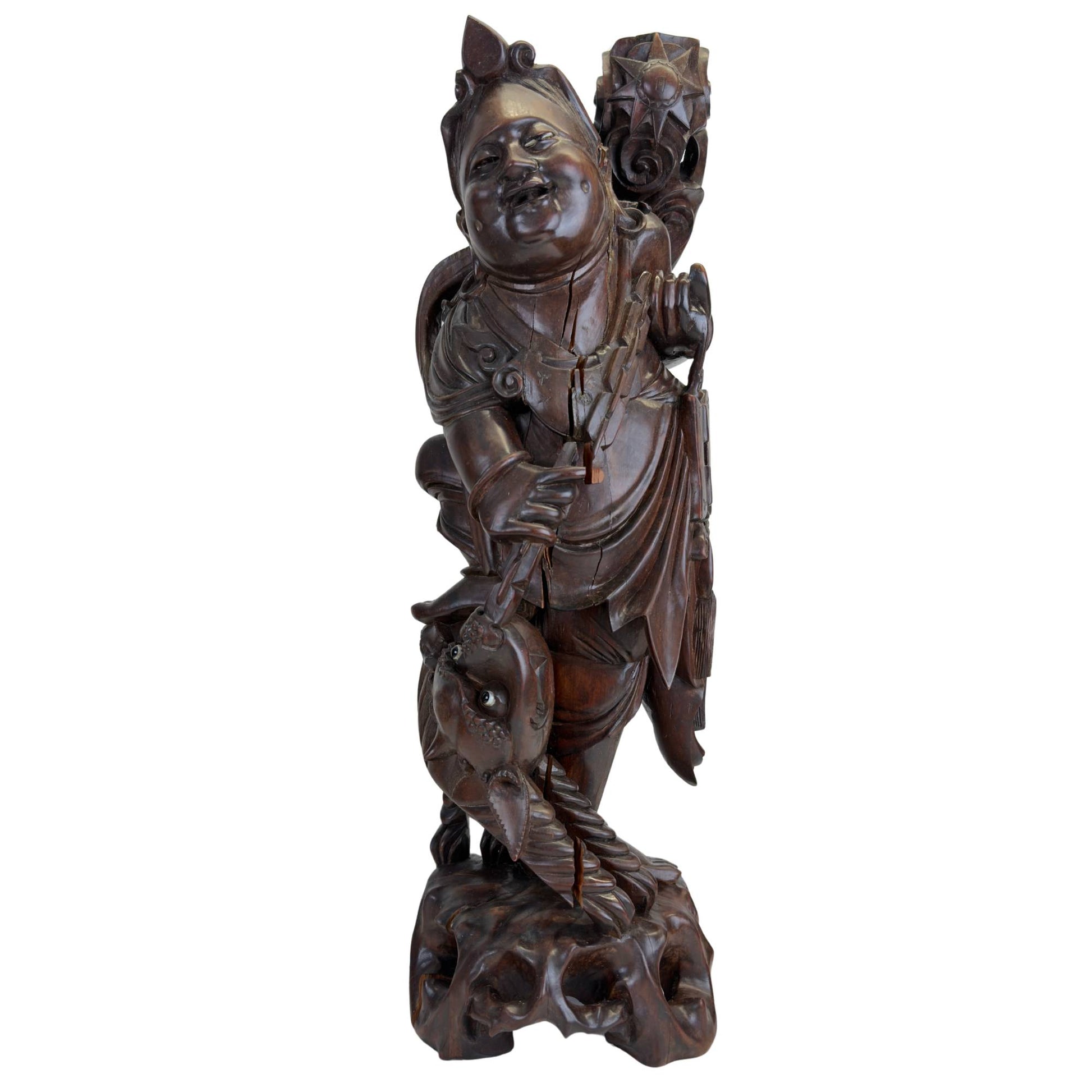 Hand-carved wooden Ebisu statue with sea bream, symbol of prosperity