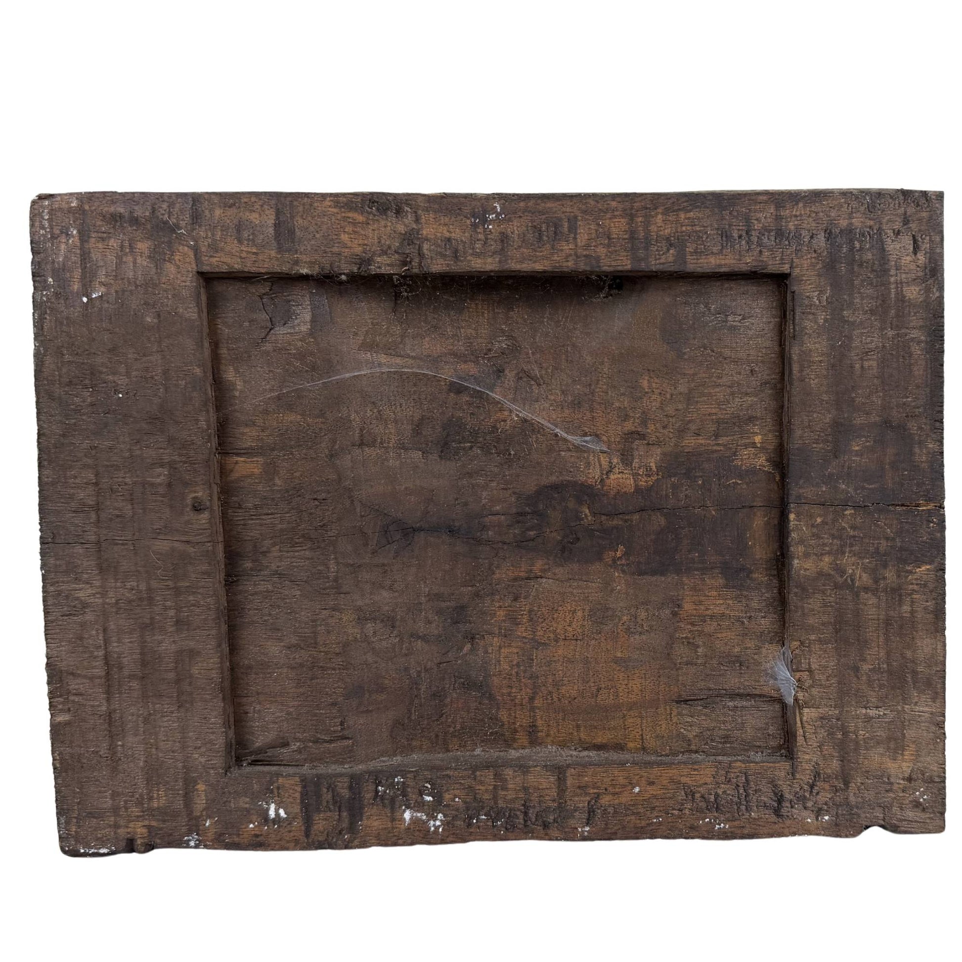 The antique hand-carved Indian temple frieze presented as a unique Wabi-Sabi wall object in a high-end interior.