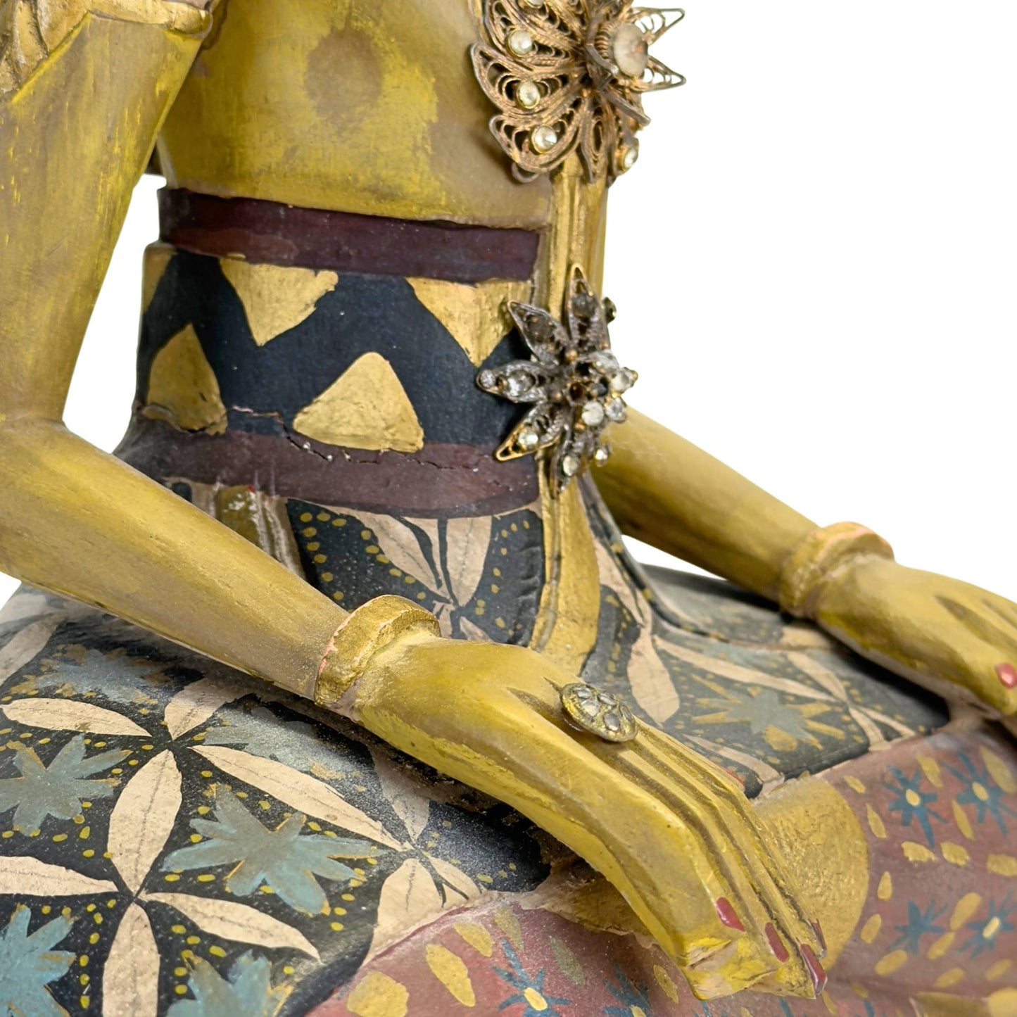 Close-up of the finely painted faces with serene expressions.