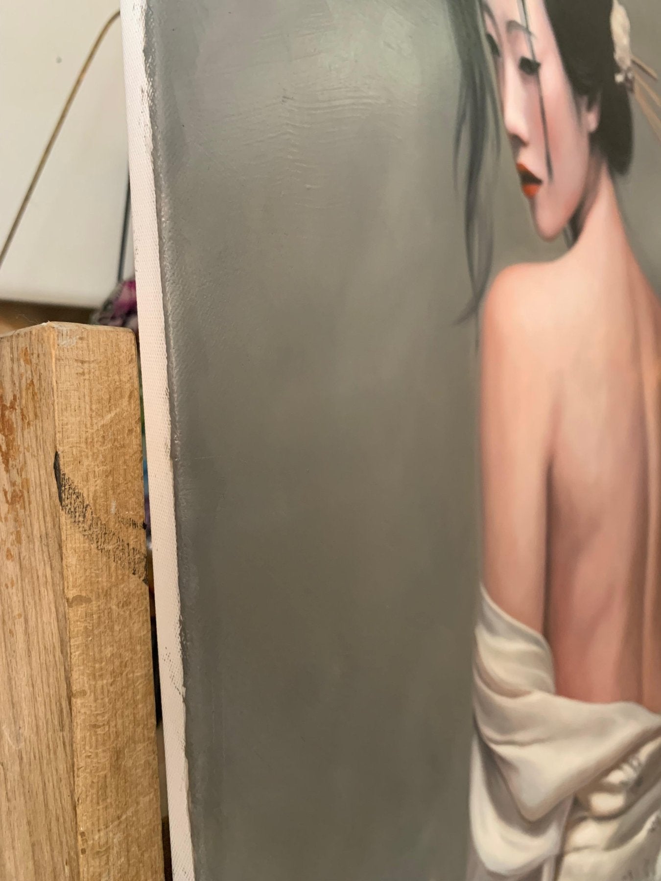 Contemporary, sensitive oil portrait with a strong chiaroscuro effect created by a burning candle flame against a minimalist grey background.