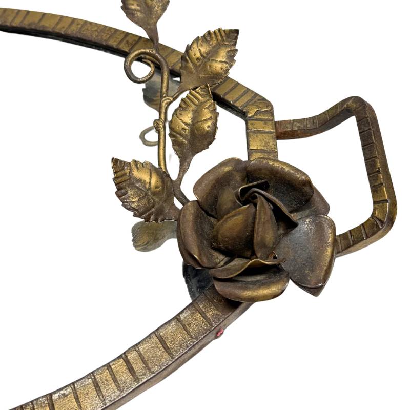 Detail of floral decorations on an antique French bronze table object
