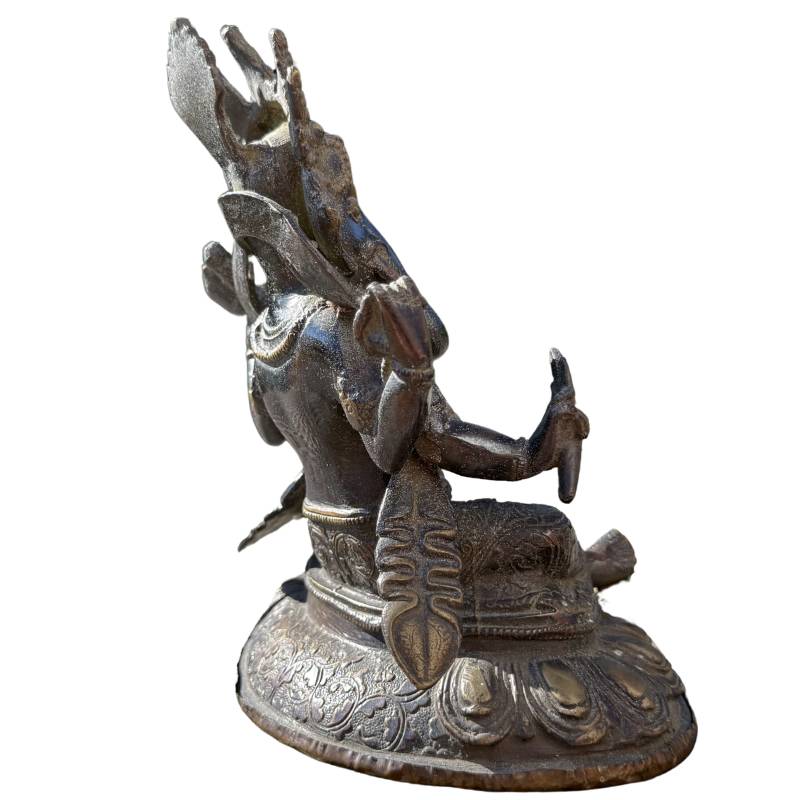 Side view of the bronze Ganesha sculpture showing the depth and detailing.