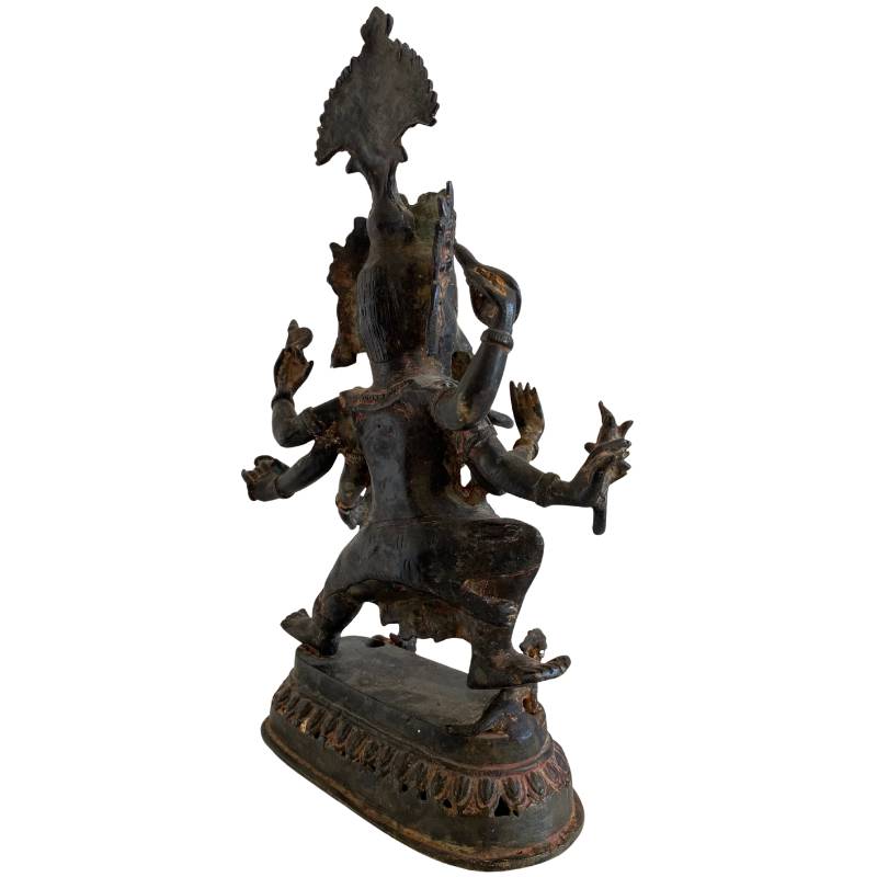 Detail of arms and ritual attributes of an antique bronze Ganesha statue