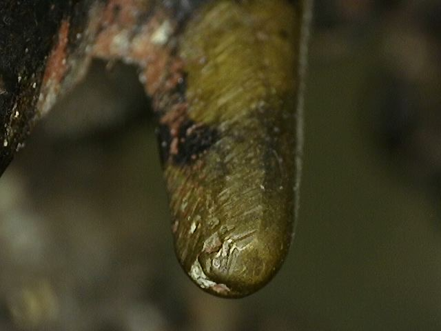 Layered patina structure visible under the microscope on Ganesha statue