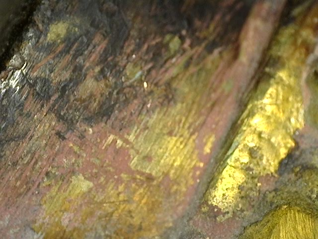 Microscopic mineral deposits in the surface of the Ganesha statue