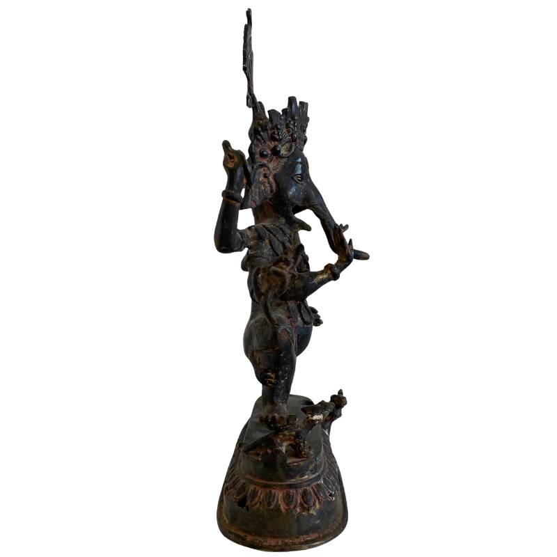 Hindu temple statue of Ganesha in a dynamic dance pose, cast in bronze