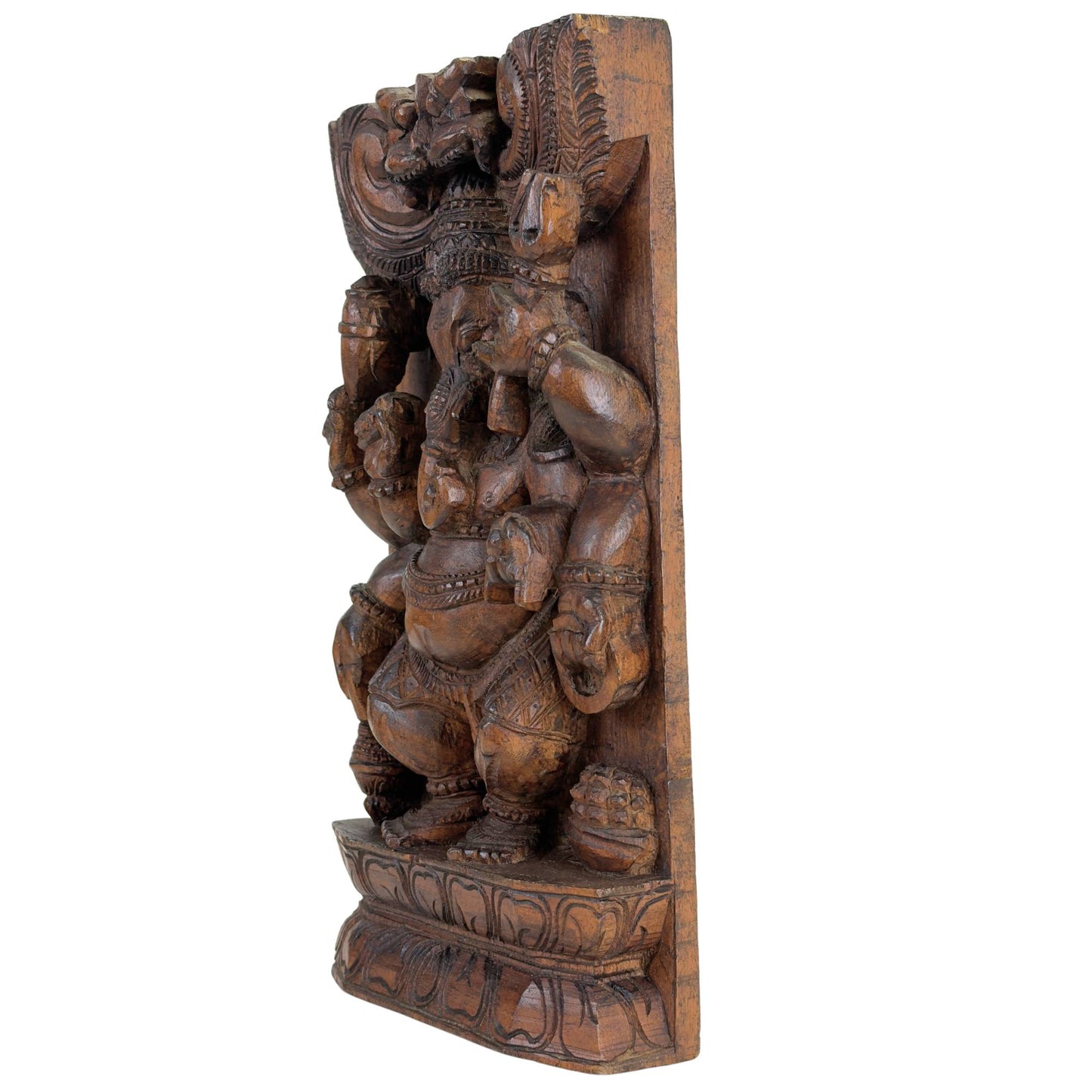 Traditional Indian temple art with Ganesha in carved wood