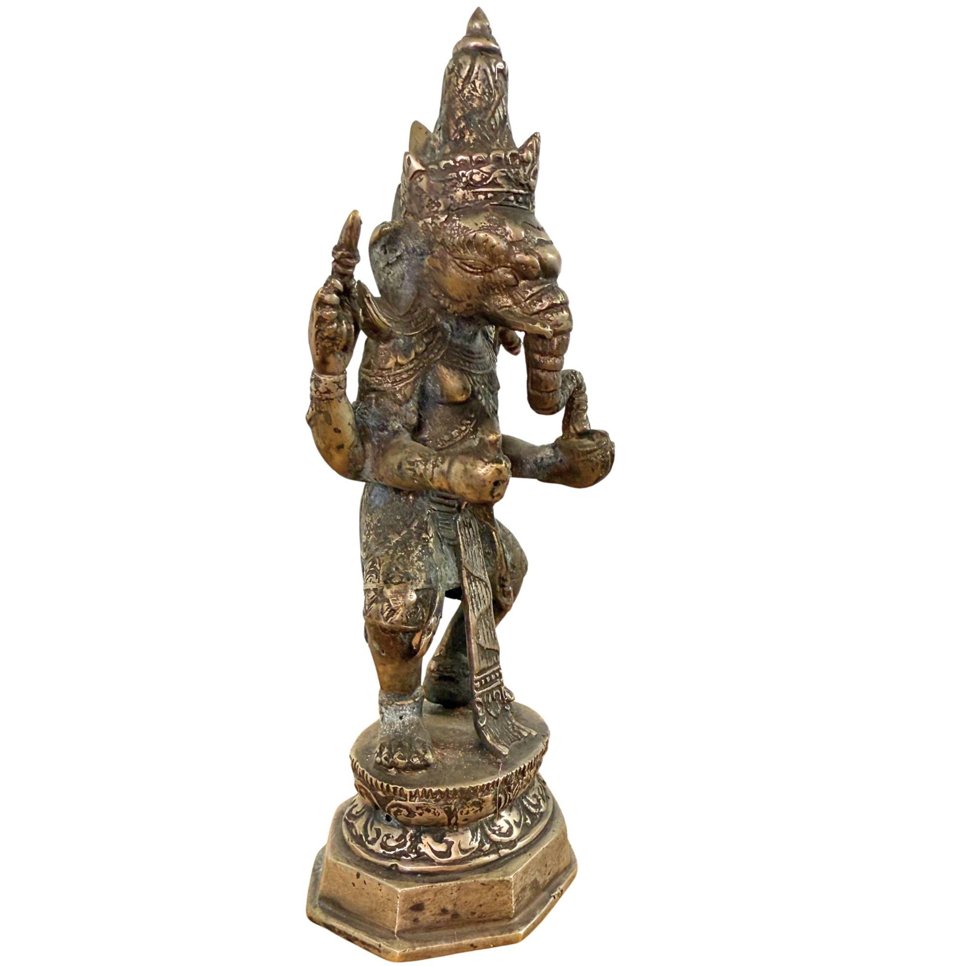 Detail of the broken tusk on the Balinese Ganesha, a symbol of sacrifice and intellectual focus.
