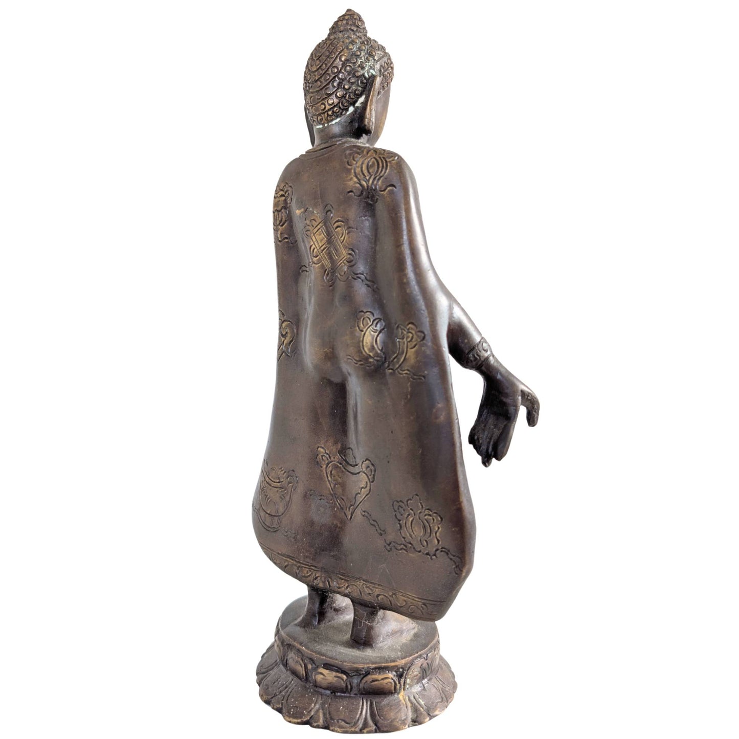 Rich symbolic engravings on the back of the bronze Buddha statue.