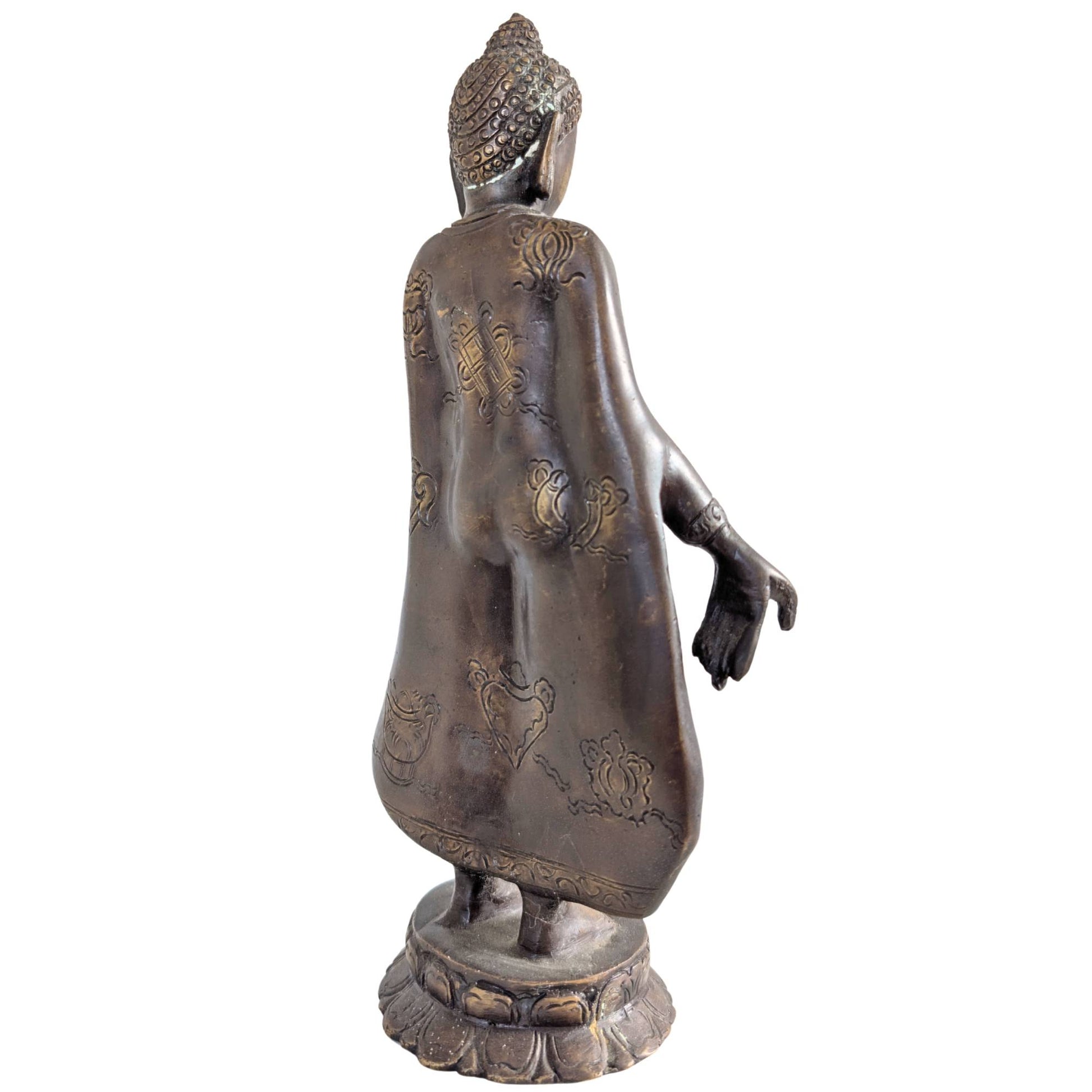 Rich symbolic engravings on the back of the bronze Buddha statue.