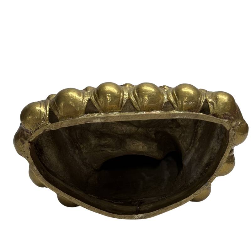 Detailed engraved Buddha statue for meditation and spiritual interior.