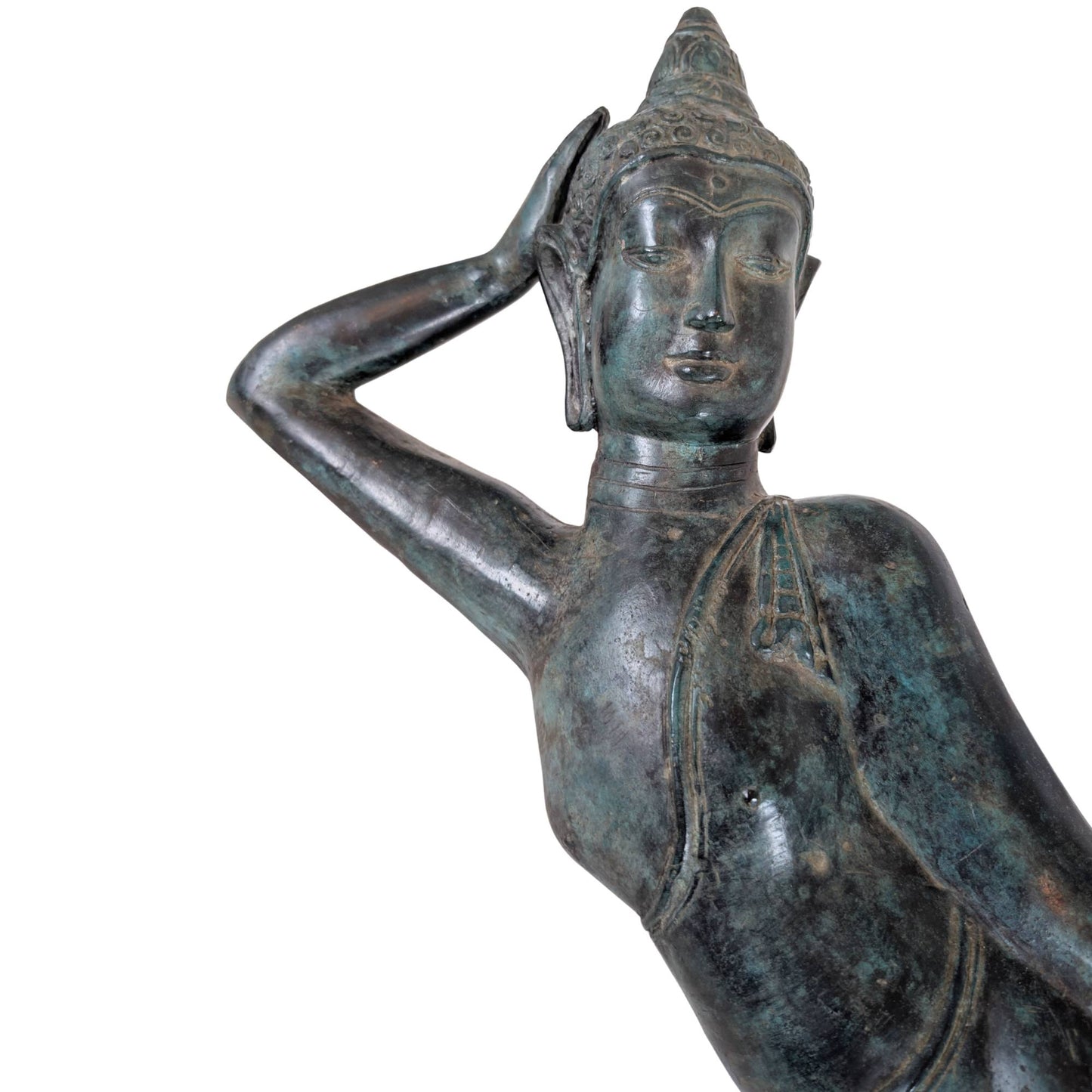 Detail of the face of a Thai Buddha with visible remnants of gilding and patina.