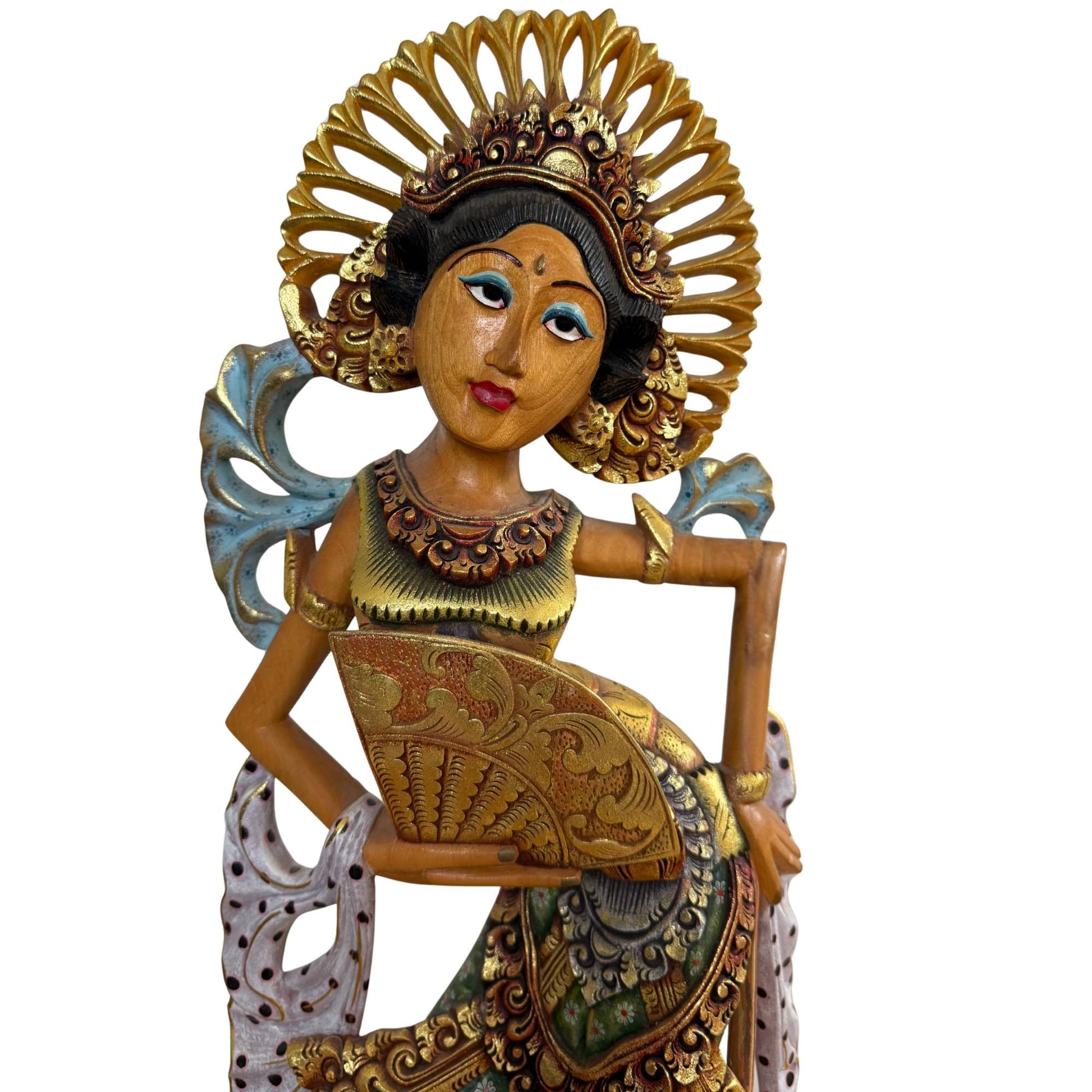 The serene facial features of the dancer, modeled after the celestial nymphs of Balinese mythology.