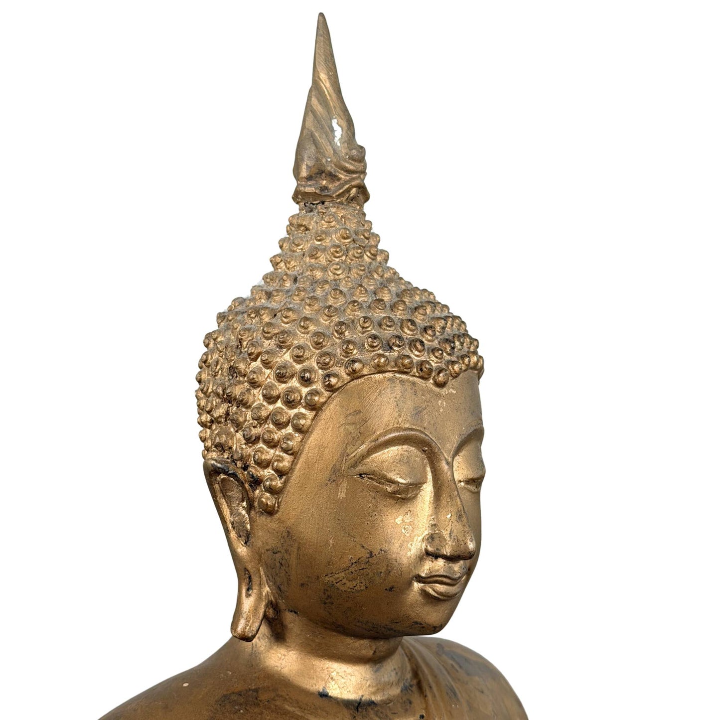 Golden bronze Buddha from Thailand with a calm facial expression