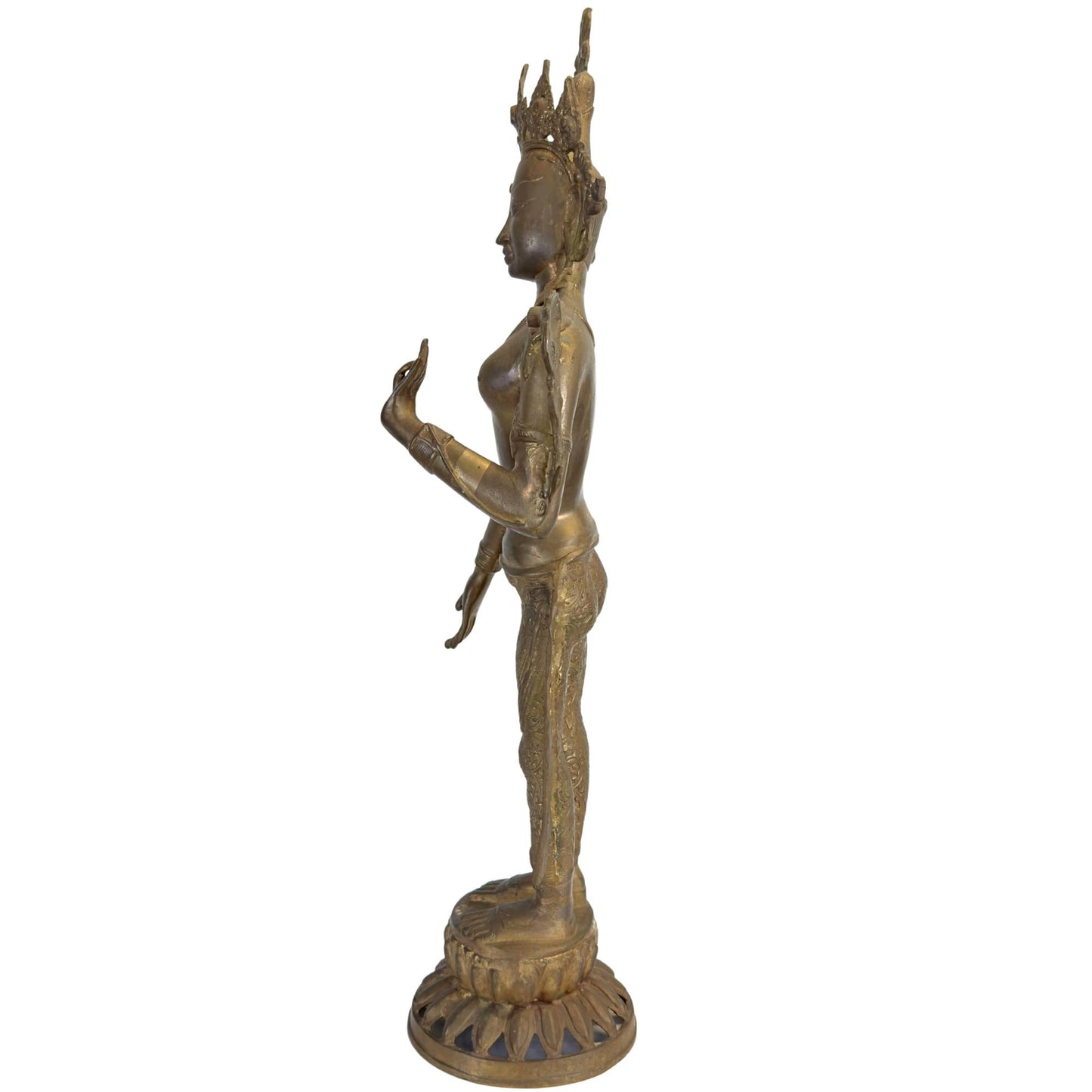 Rear view of an antique bronze Green Tara with richly engraved dhoti and fire gilding.