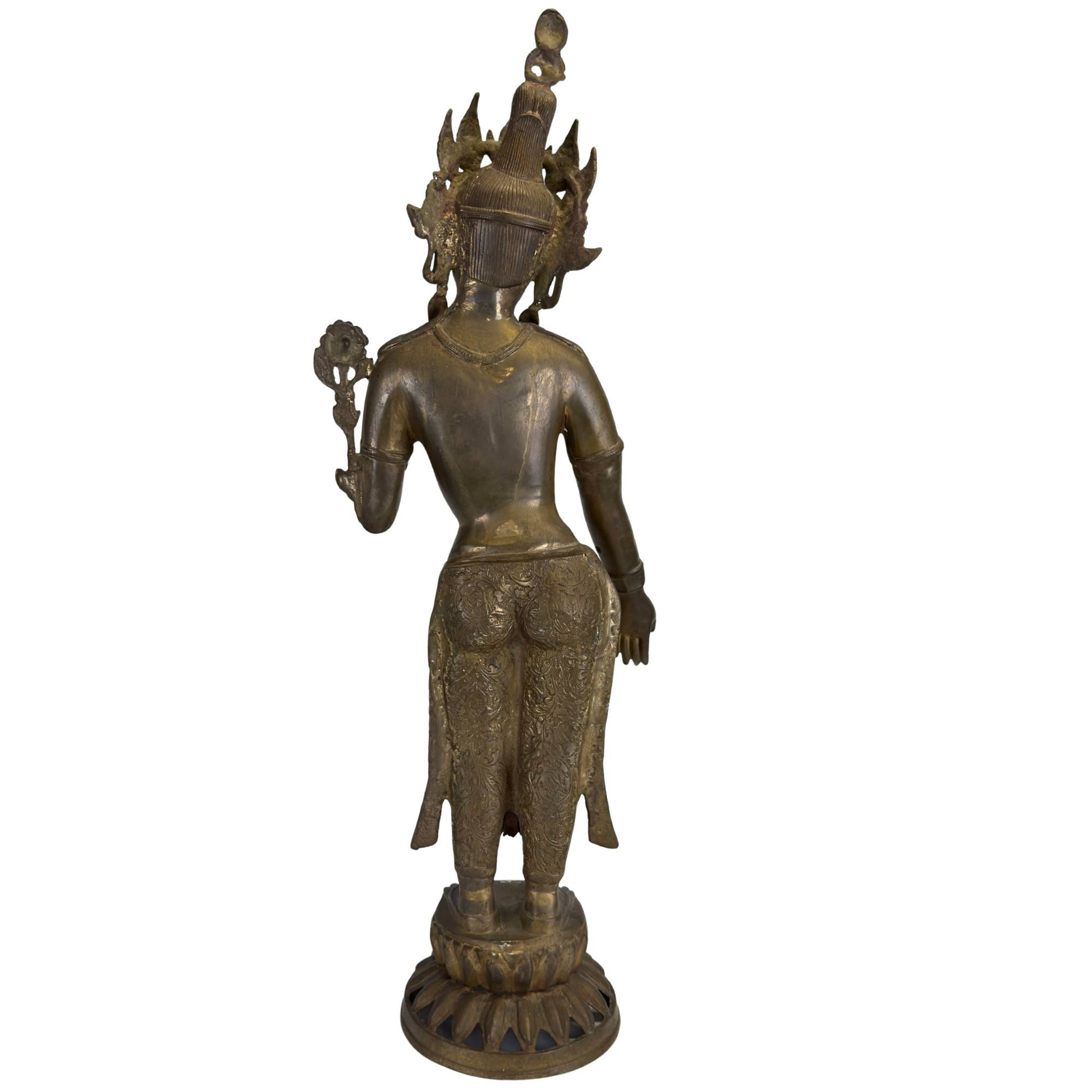 Reverse side of an antique fire-gilded Green Tara with refined Nepalese engravings.
