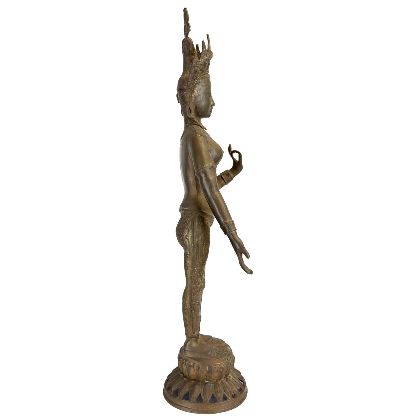 Left profile of an antique bronze Green Tara from Nepal on a lotus base.