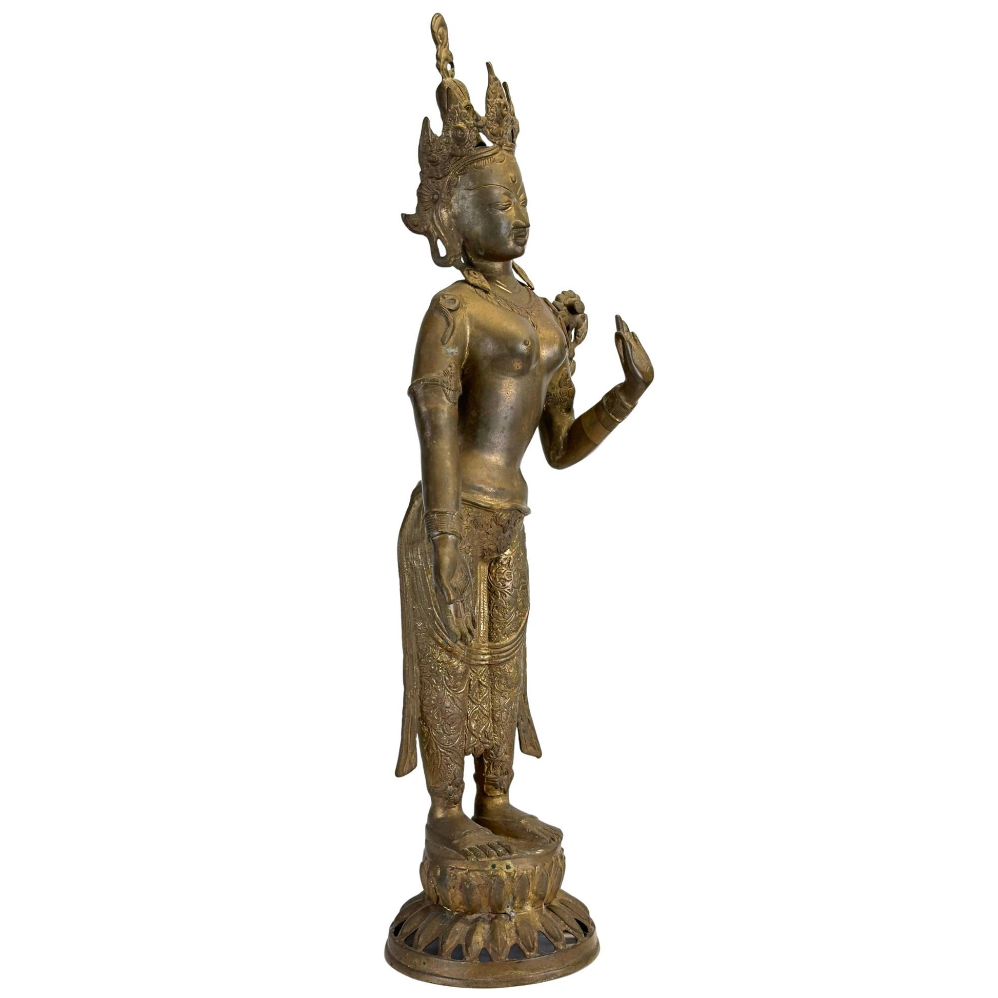 Left front of an antique Nepalese Green Tara with original fire gilding and engraved clothing.
