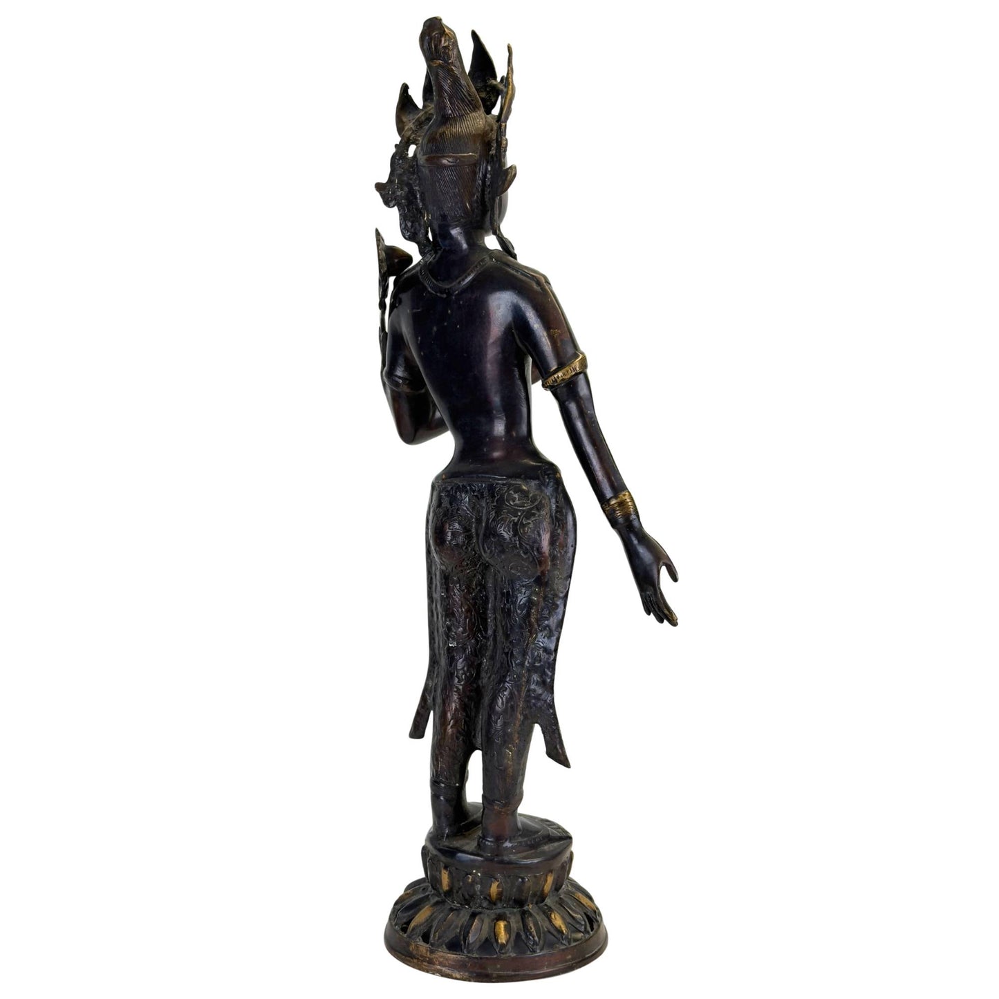 Rear view of an antique Green Tara with richly engraved clothing and authentic patina