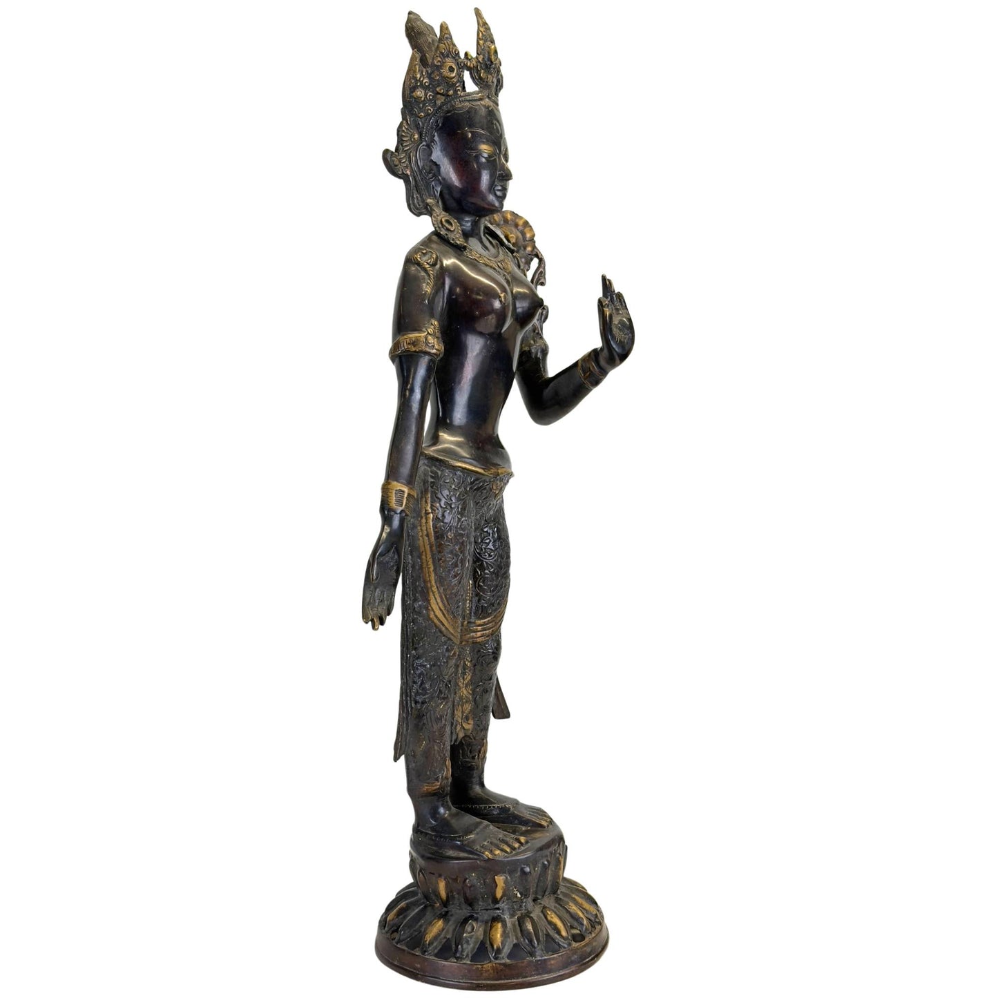 Left profile of an antique bronze Green Tara on a double lotus base.