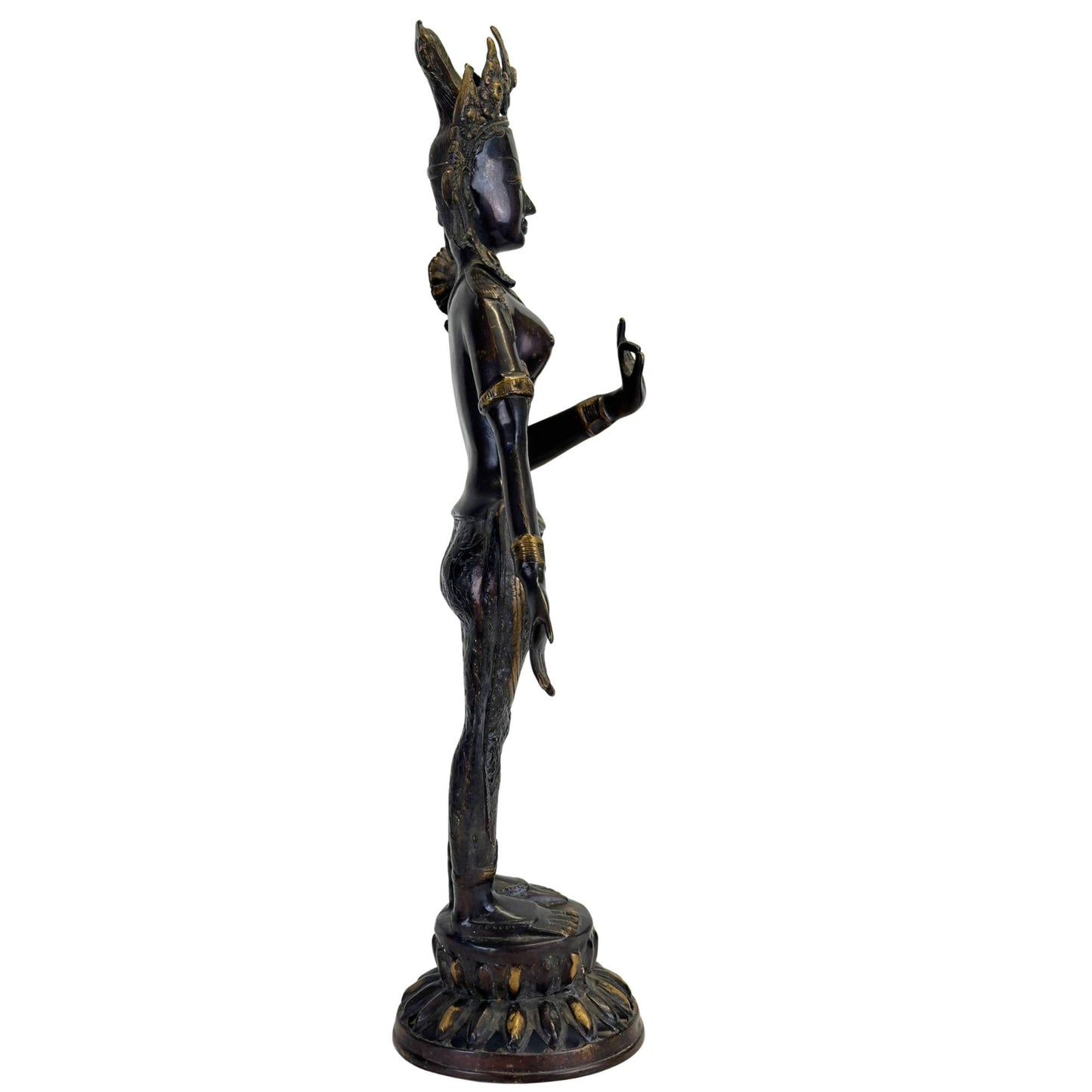 Antique bronze Green Tara from Nepal in right profile with elegant tribhanga pose, black Newar patina, and original fire gilding.