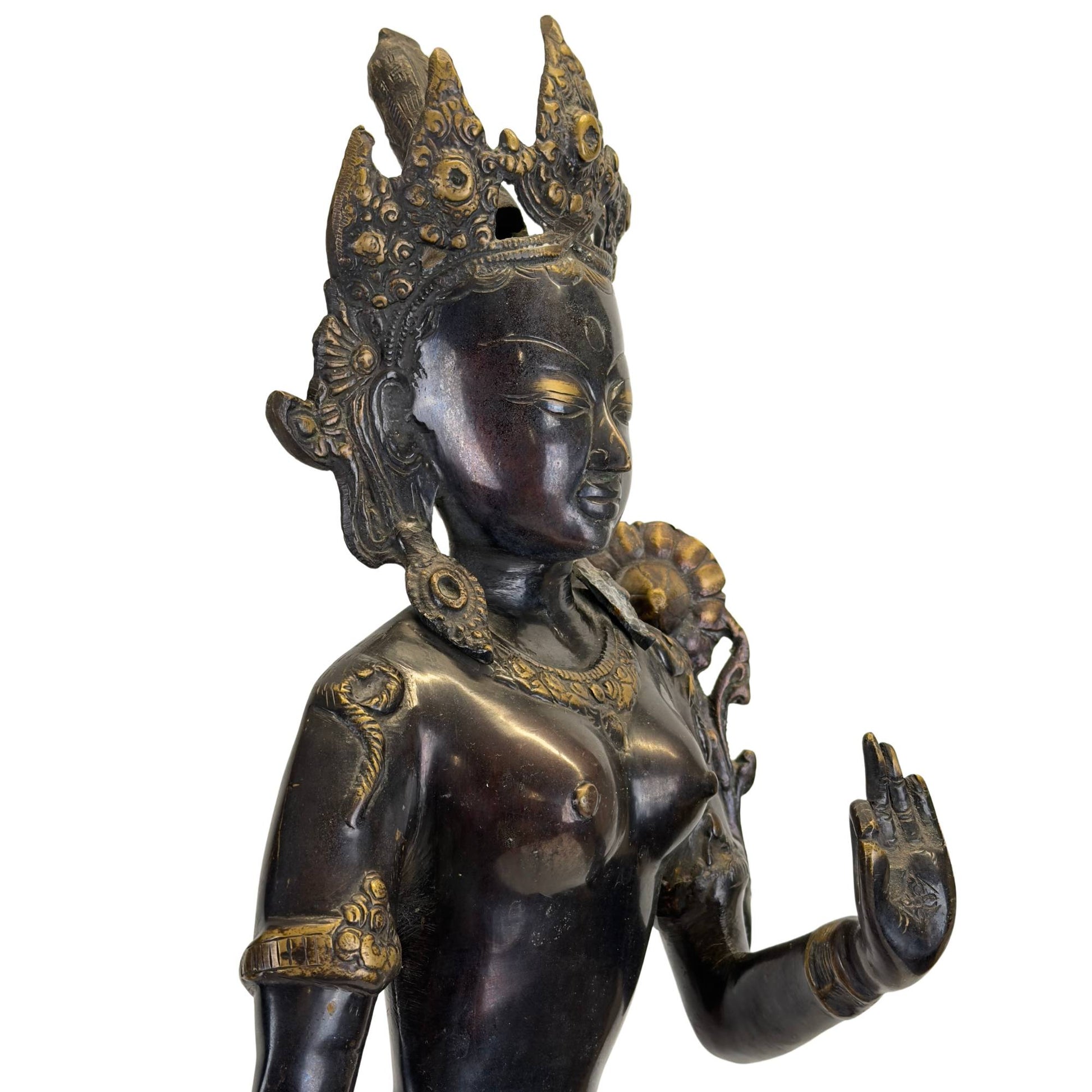 Right front side of an antique Nepalese Green Tara with original fire gilding.