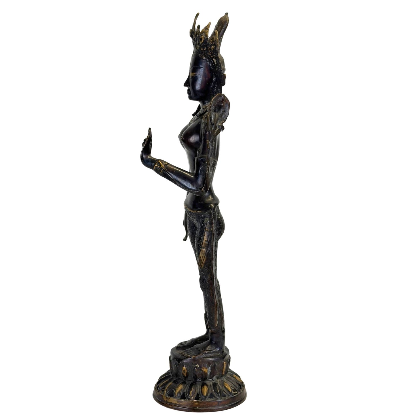 Side view of an antique bronze Green Tara from Nepal with an elegant tribhanga pose, black Newar patina, and fire-gilded details.