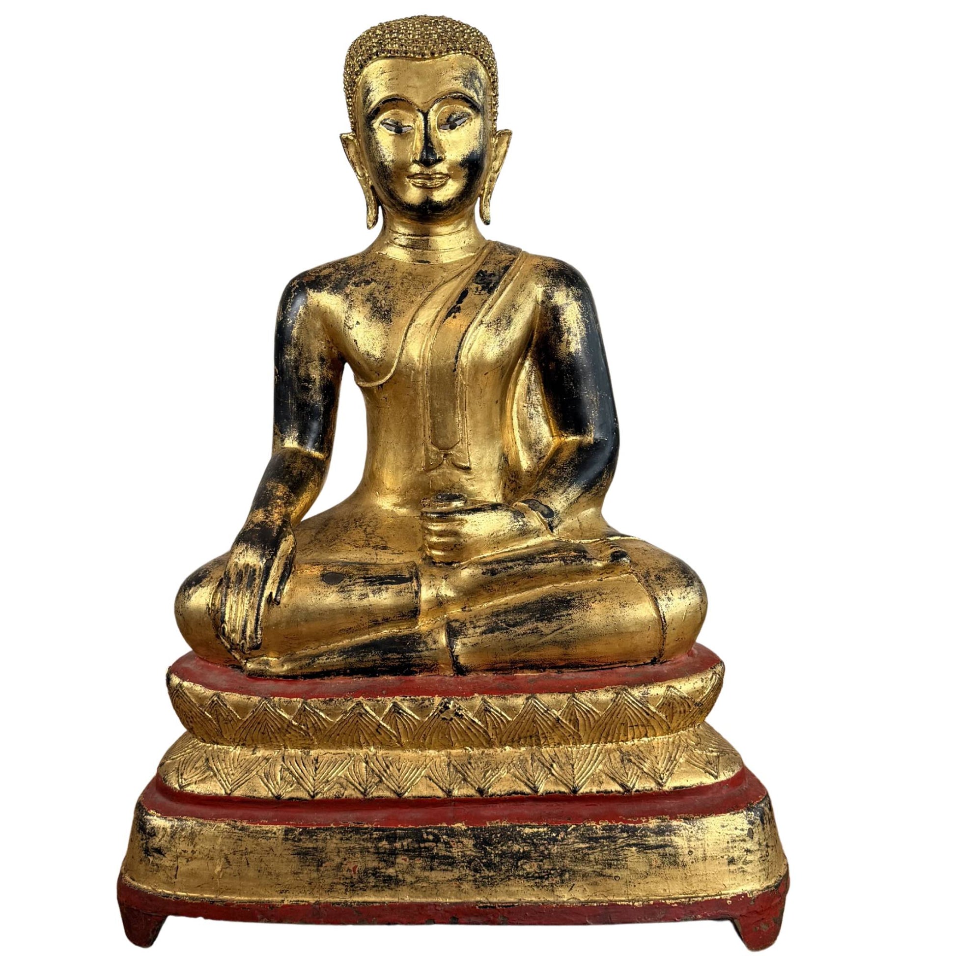 Large gilded wooden Buddha statue from Burma with inlaid eyes, red lacquer base, and meditative appearance for altar or interior