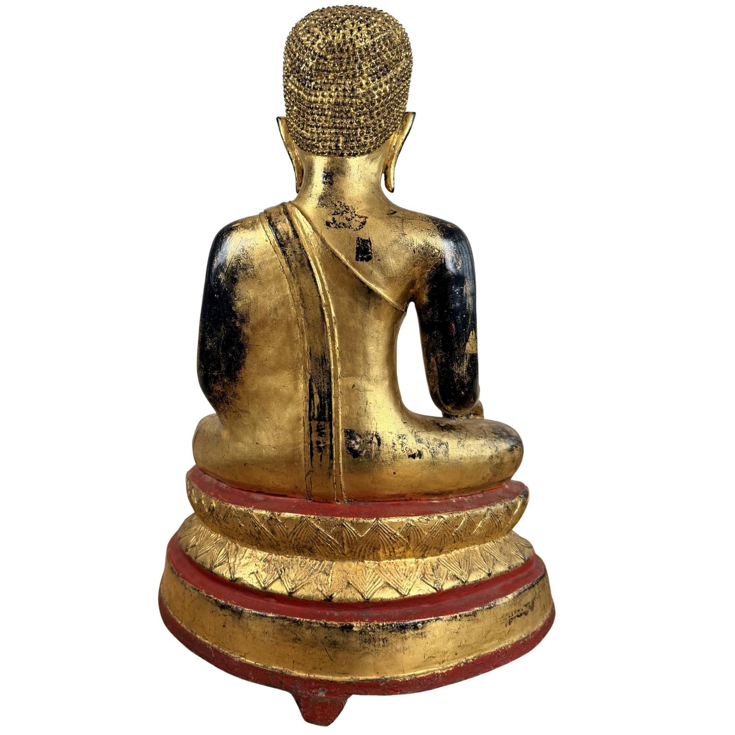 Large fire-gilded bronze Buddha statue with inlaid eyes, red accents, and a meditative appearance for altar or interior