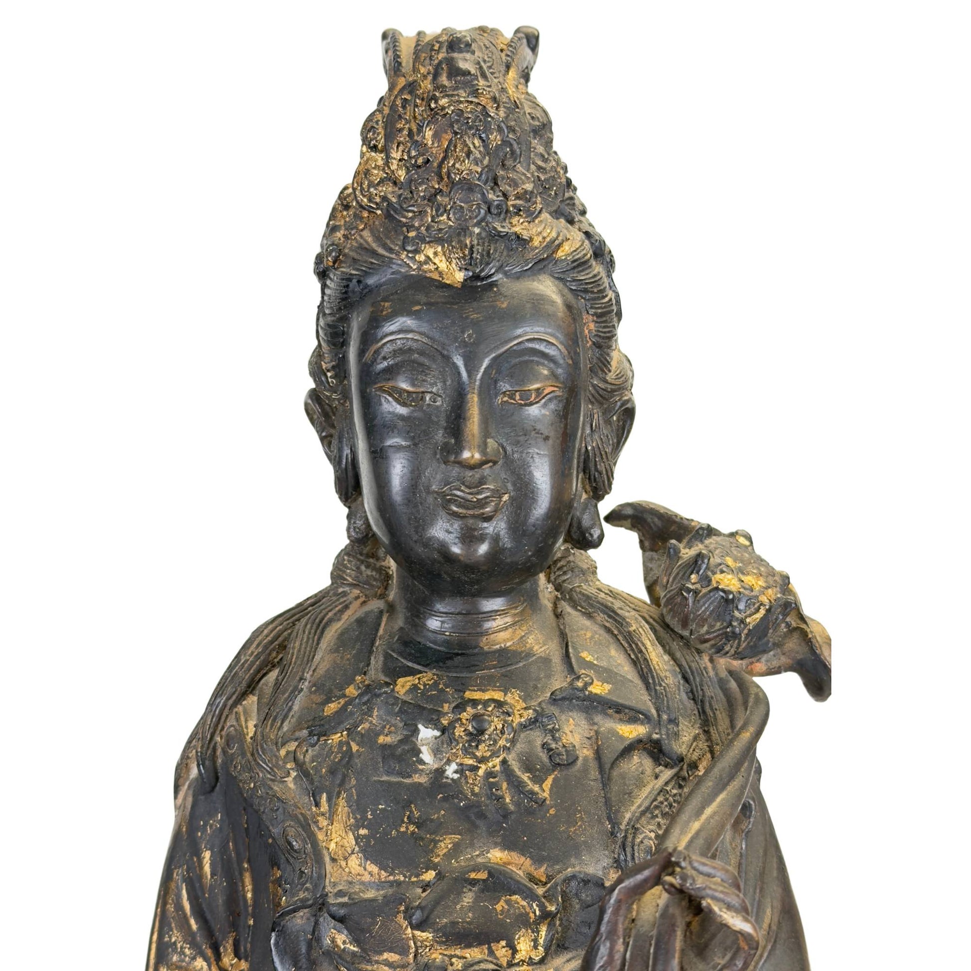 Large spiritual Guanyin sculpture in bronze, executed in the older East Asian temple tradition with a dragonfish base