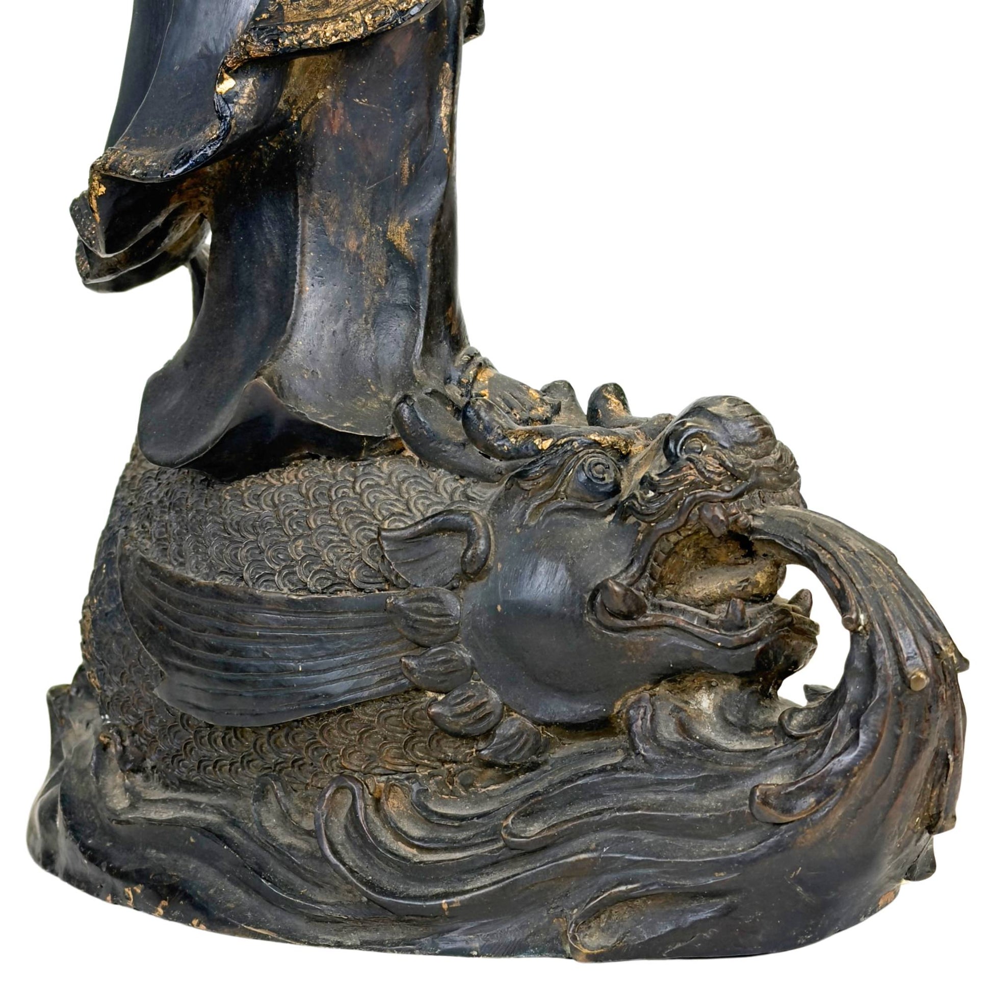 Guanyin bodhisattva statue in bronze with old dark patina, wear, and decorative details