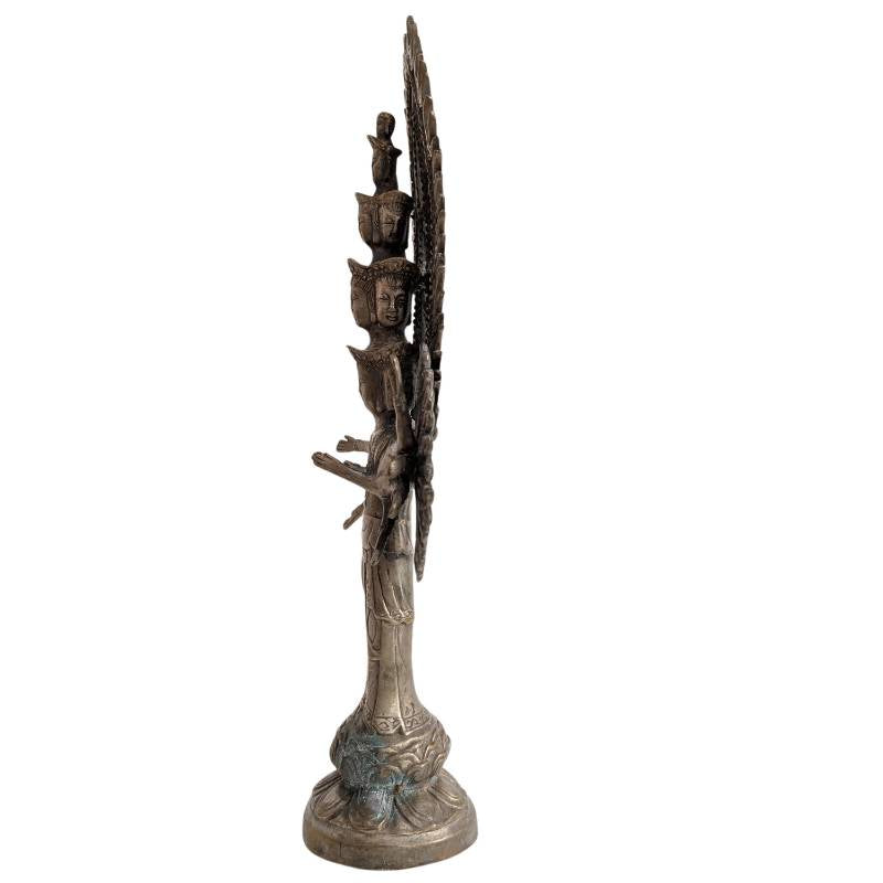 Chinese Guanyin statue in bronze with multiple heads and arms, Buddhist tradition