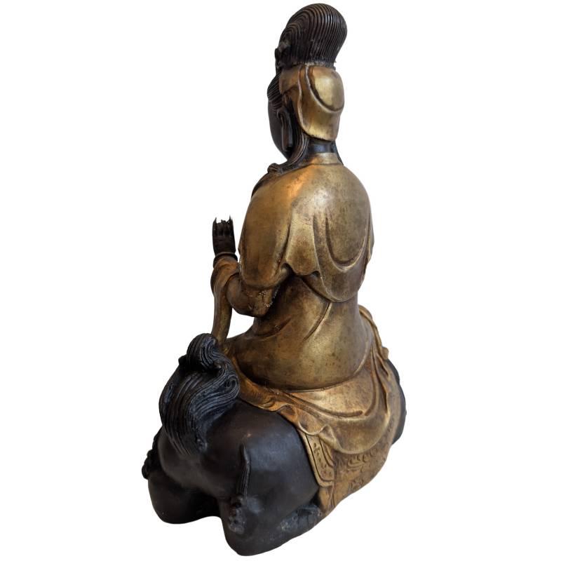 Buddhist Guanyin statue on a bronze lion