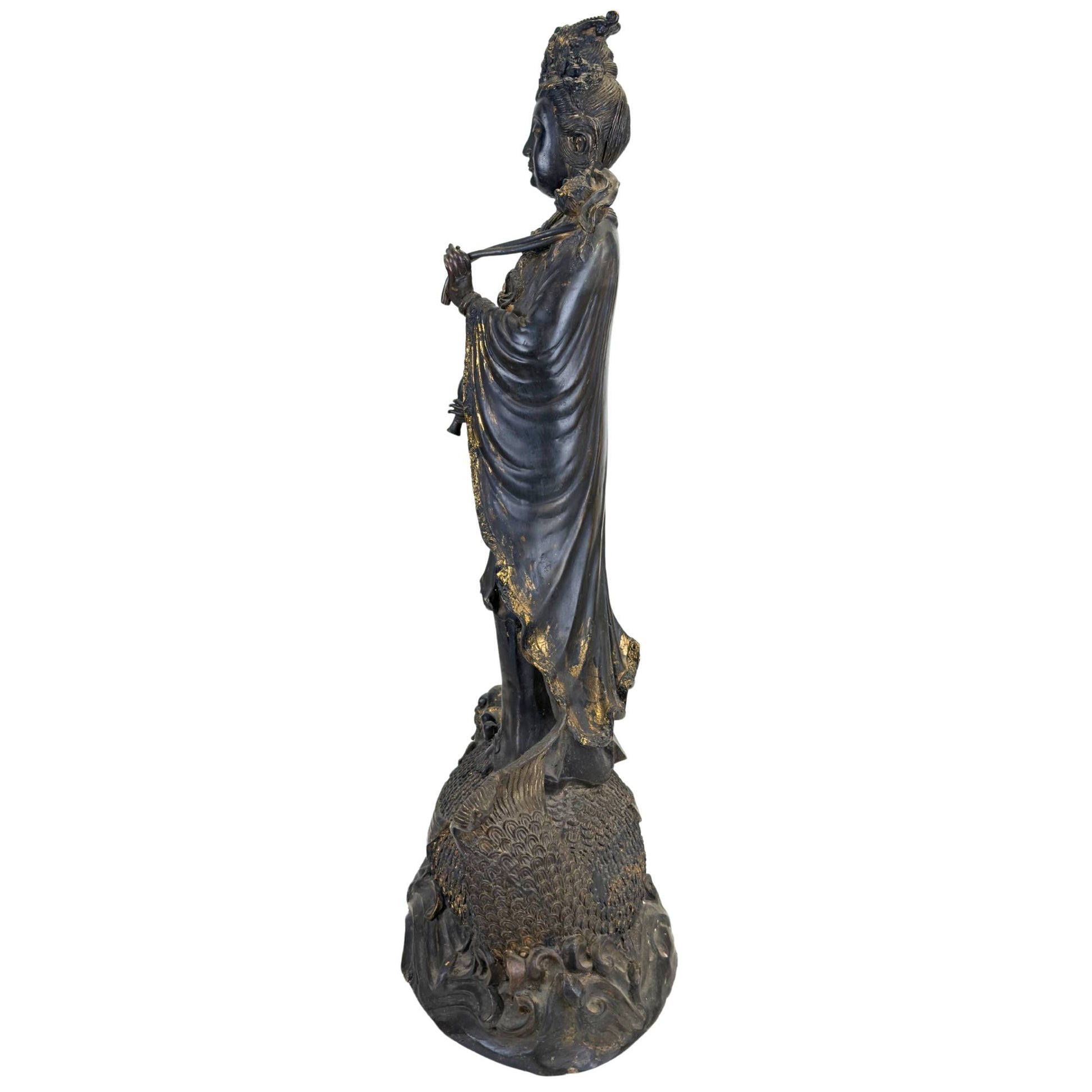 Guanyin on a makara-like dragonfish, unique East Asian bronze art object with an aged patina
