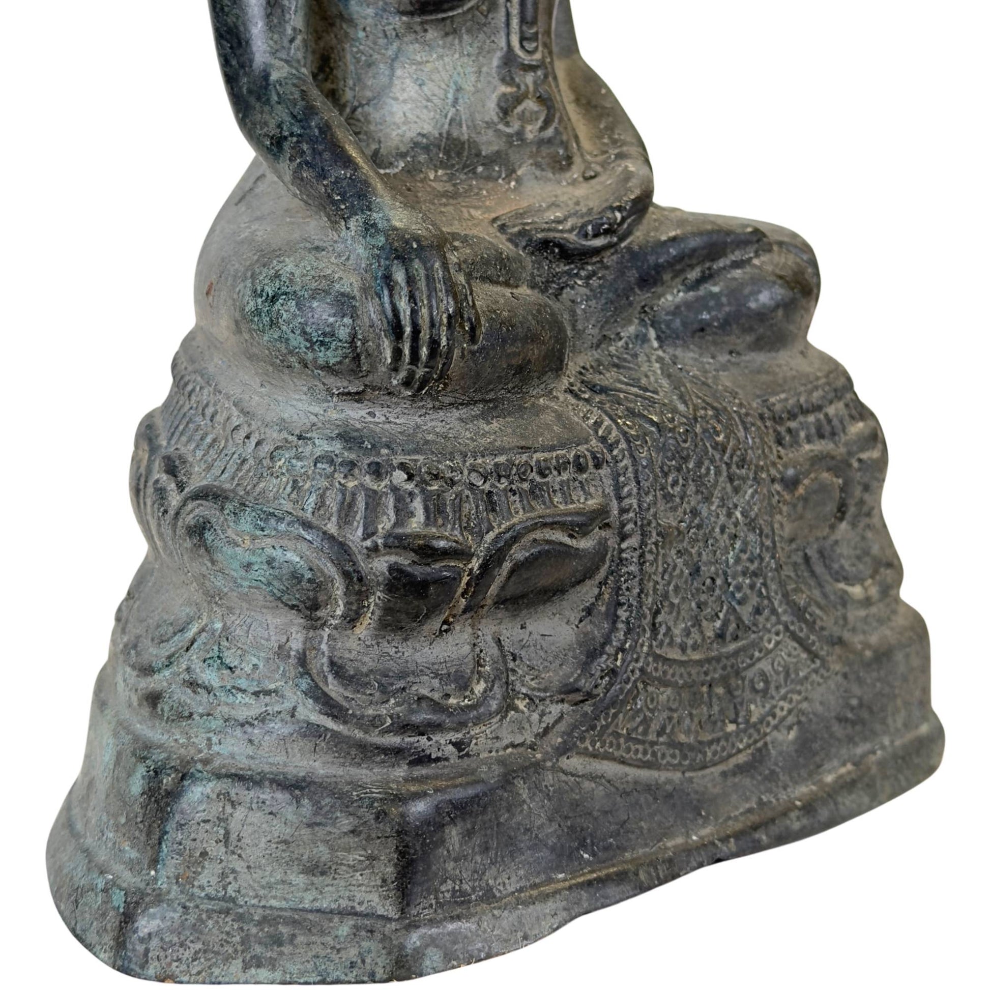 Hand-cast Buddha statue retaining the original earthen casting core.