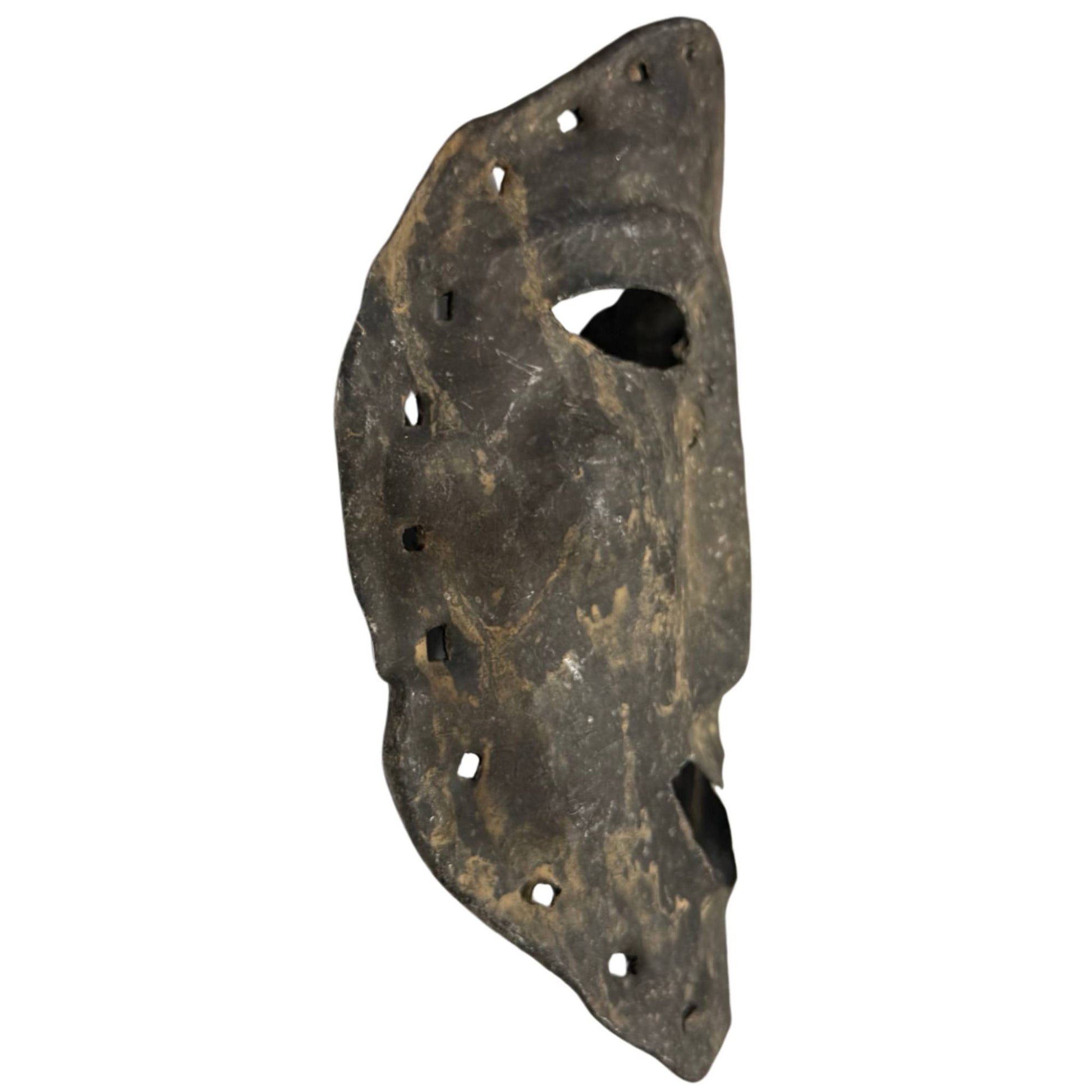 Hand-beaten metal mask from the Himalayan region, rare shamanistic object with mounting holes all around
