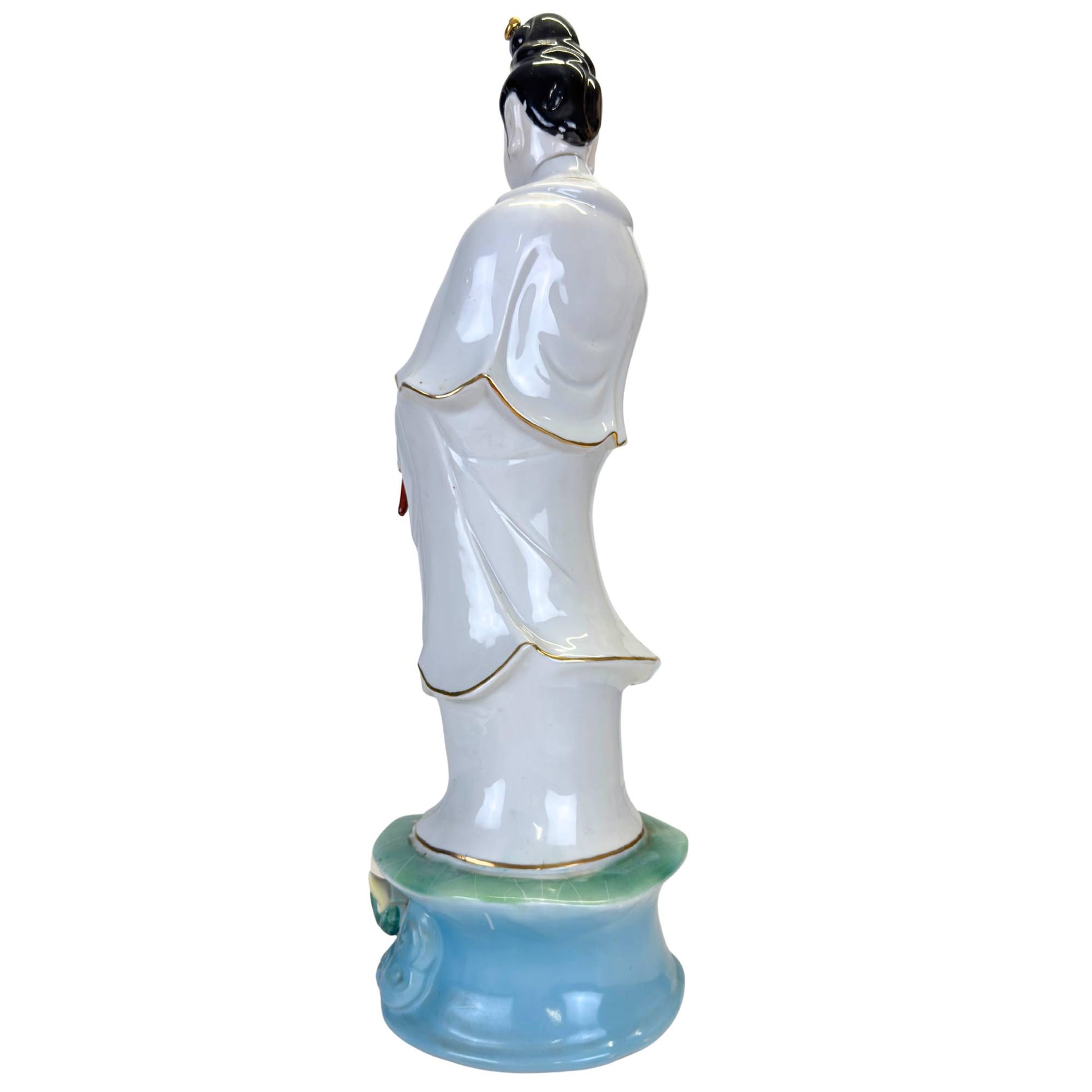 Hand-painted lotus pedestal in pastel colors at the base of a large statue.