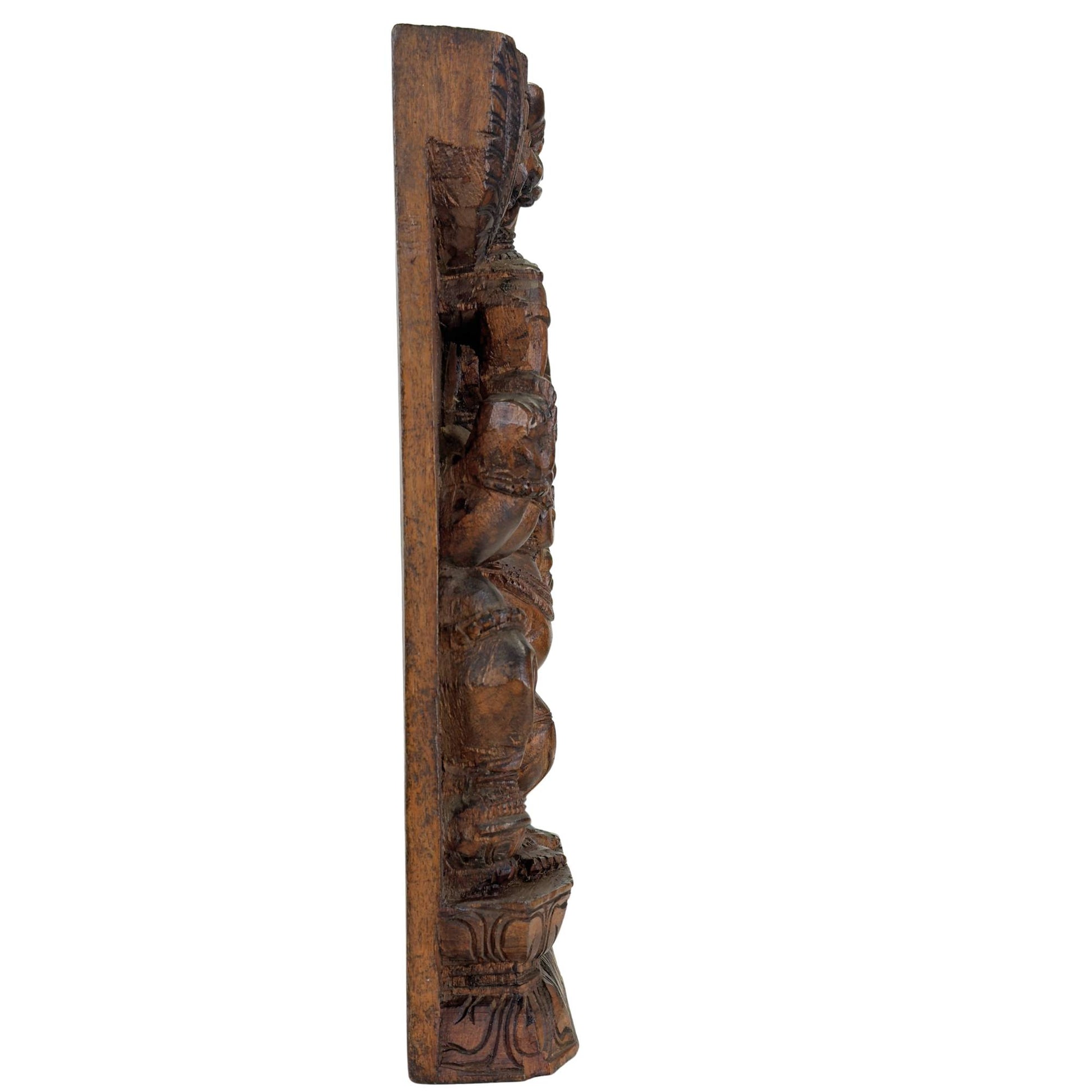 Hand-carved wooden Ganesha as a wall relief with rich details